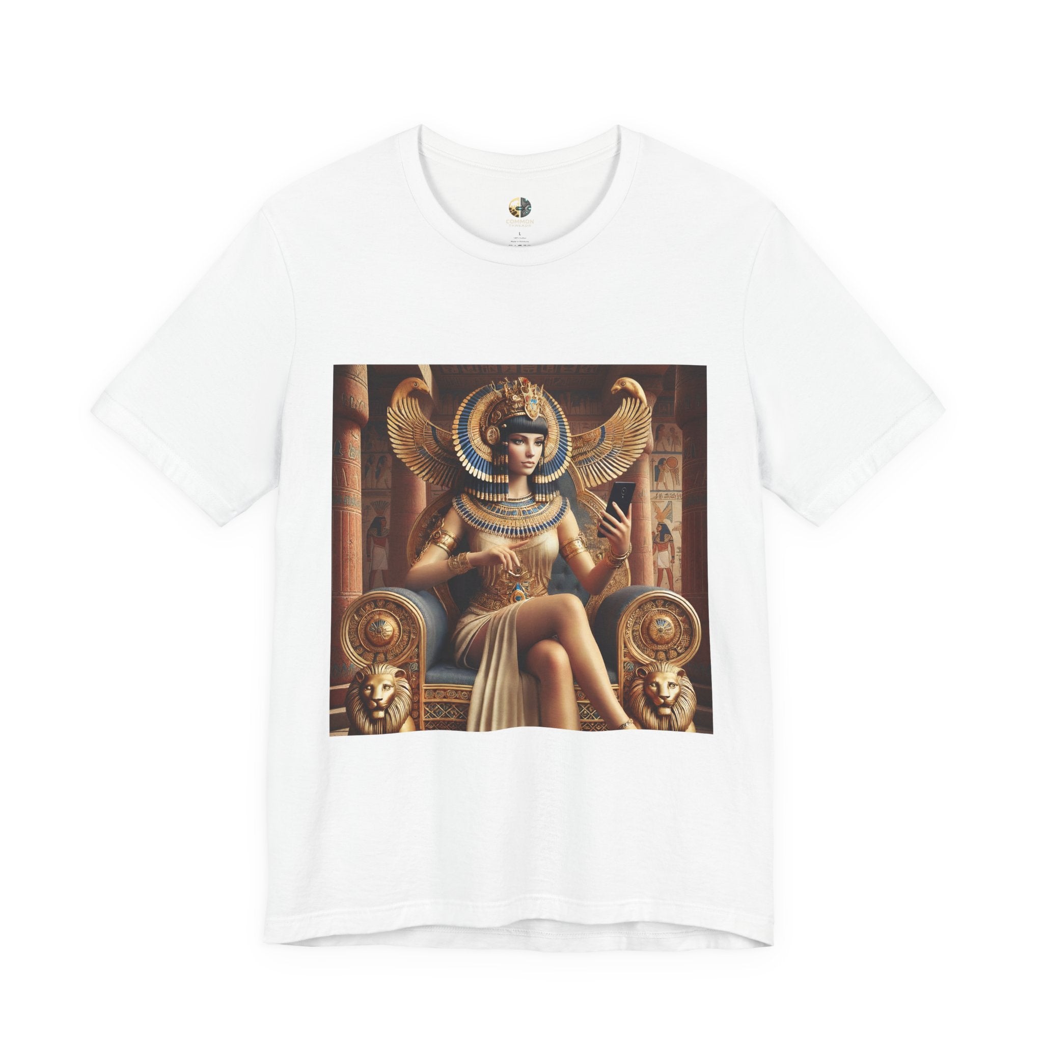 White T-shirt featuring a graphic of Cleopatra wearing an ornate headdress and gold jewelry, seated on a throne and holding a smartphone for a selfie, with temple architecture in the background
