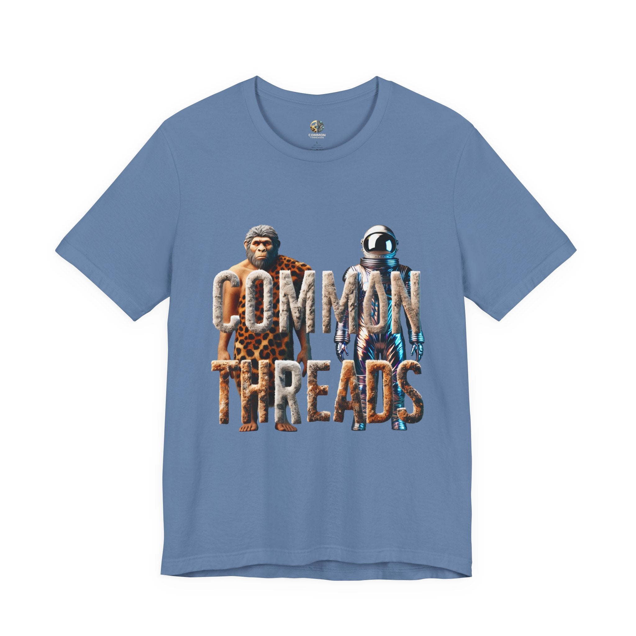 Lavender blue T-shirt featuring a graphic of a caveman in animal pelts standing beside a chrome-plated astronaut, with the text ‘Common Threads‘