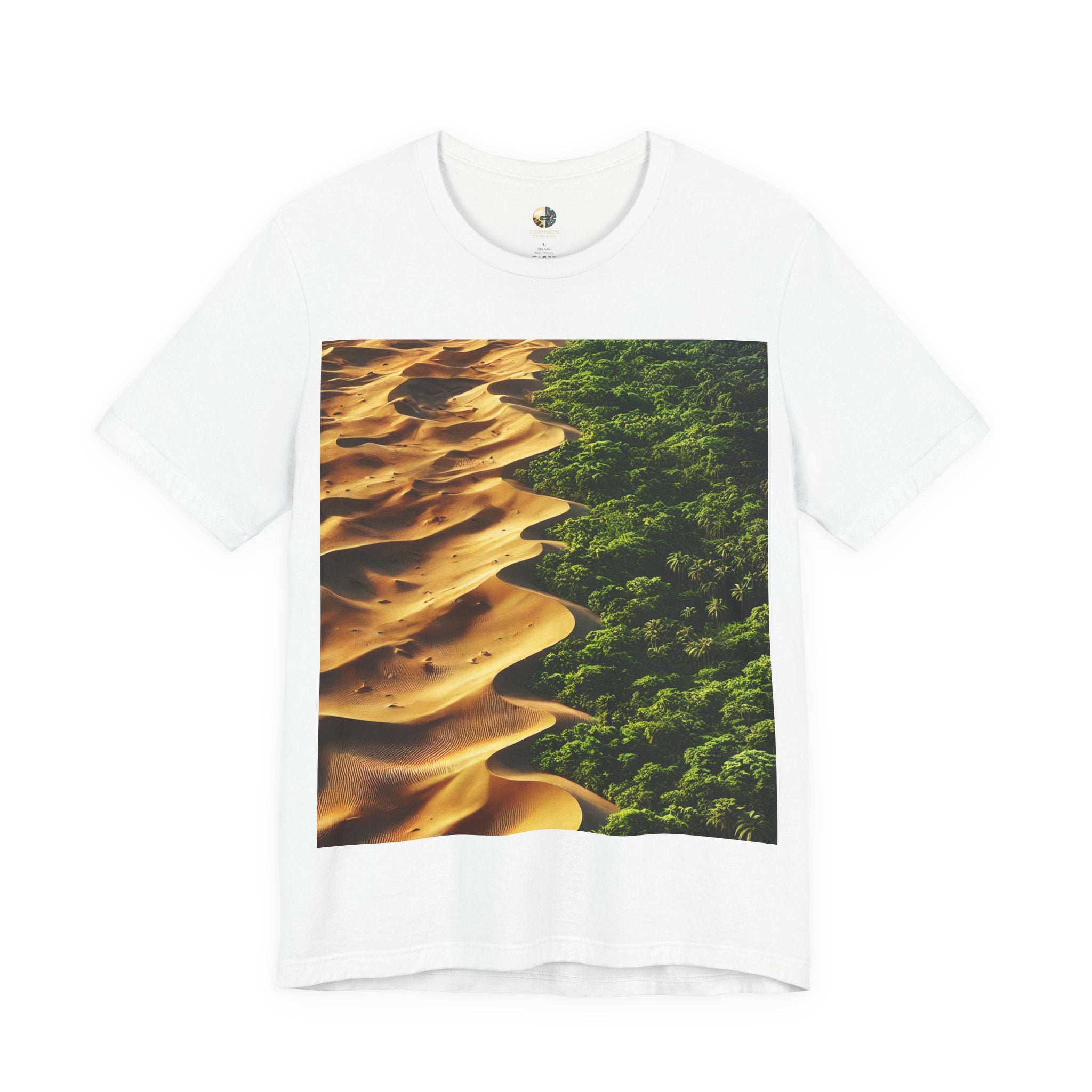 White T-shirt featuring a split landscape with golden desert sand dunes on one side and a dense green rainforest on the other