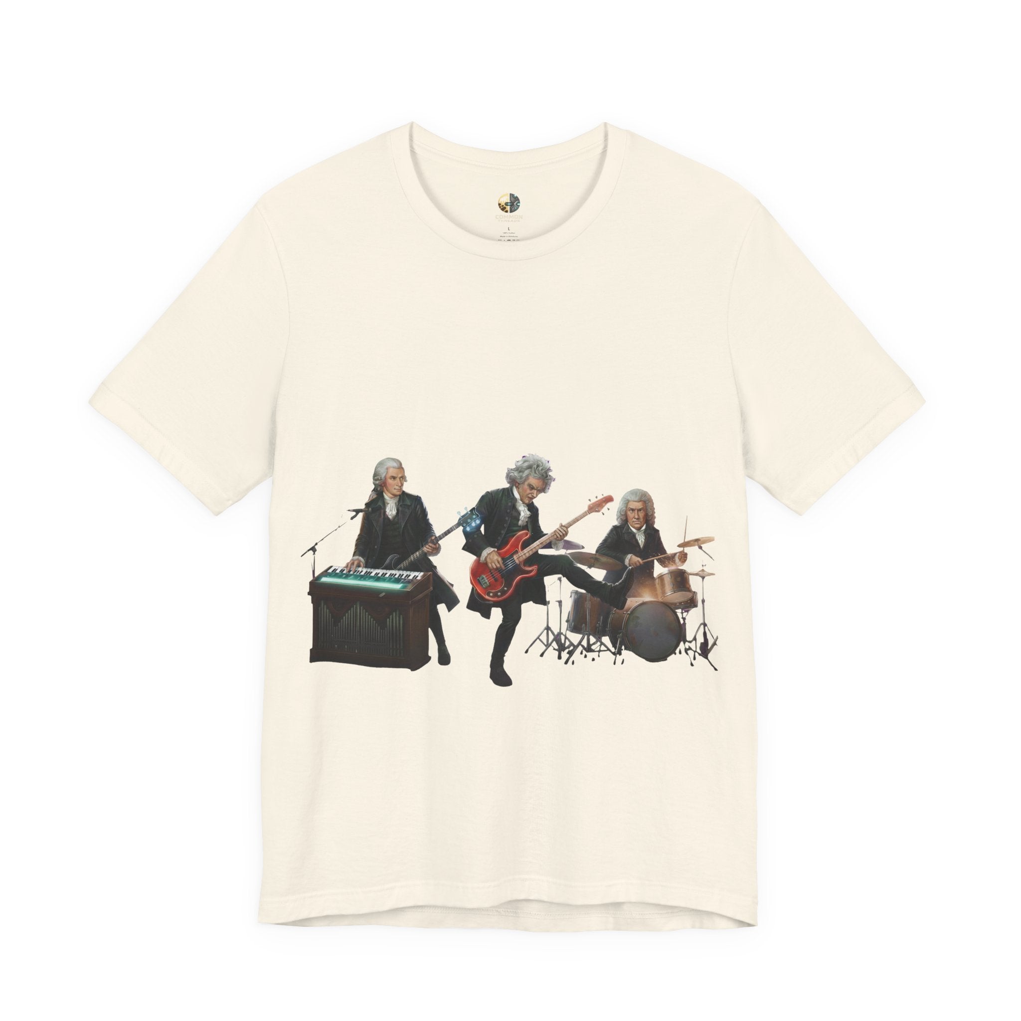Natural color t-shirt featuring Mozart on bass and keyboard, Beethoven on electric guitar, and Bach on drums in a rock band scene
