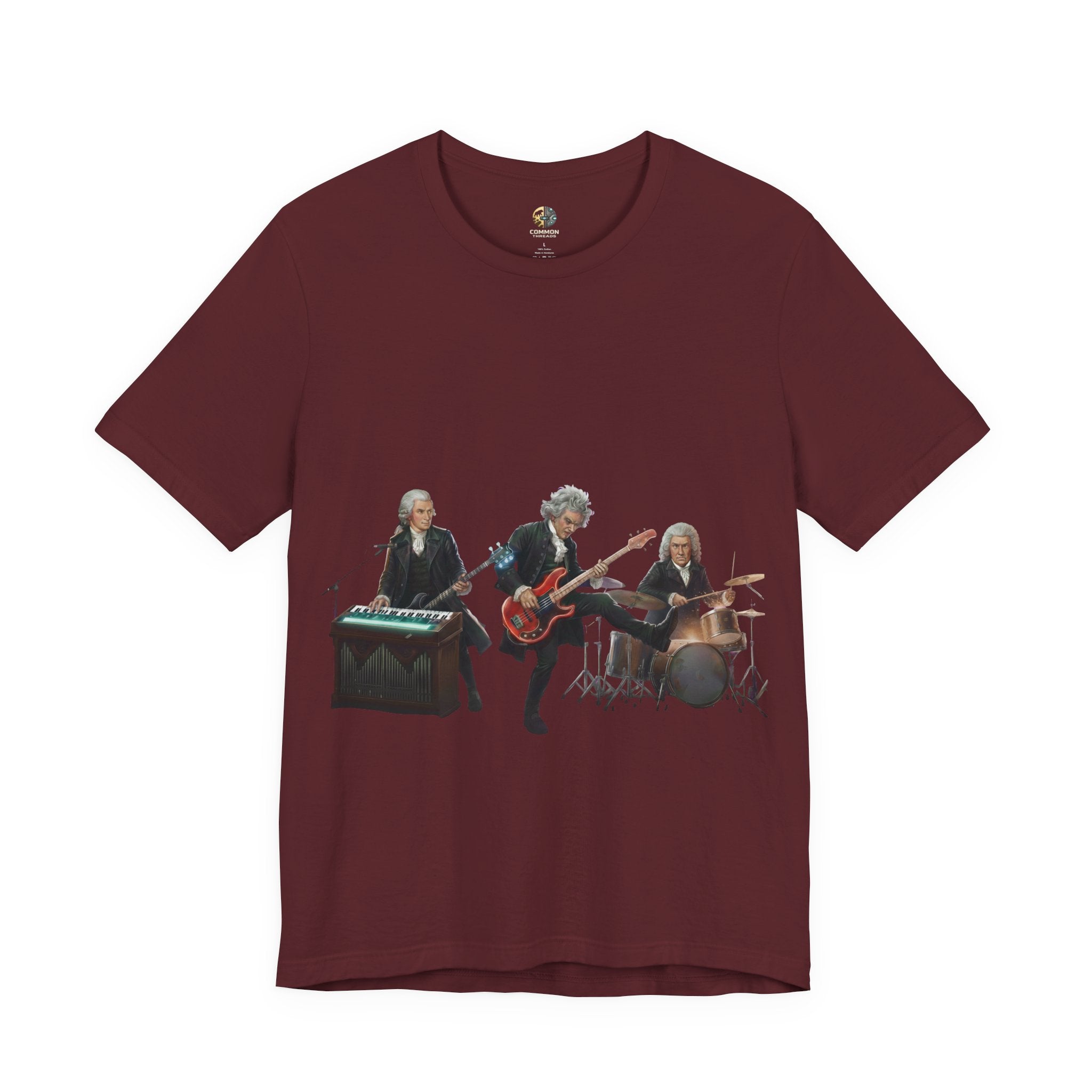Maroon color t-shirt featuring Mozart on bass and keyboard, Beethoven on electric guitar, and Bach on drums in a rock band scene