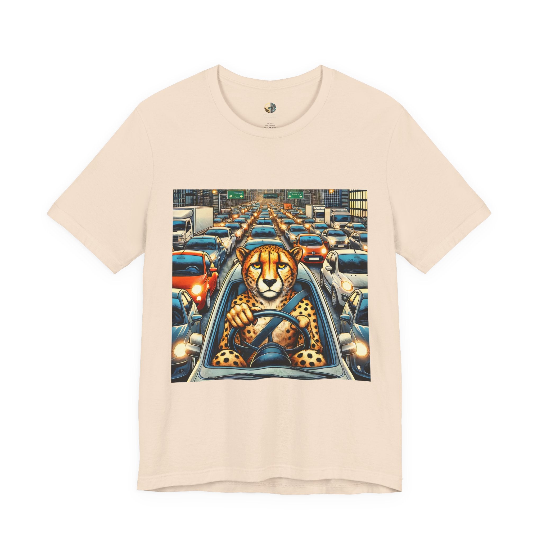Soft creme T-shirt featuring a graphic of a cheetah sitting in the driver’s seat of a car stuck in heavy city traffic