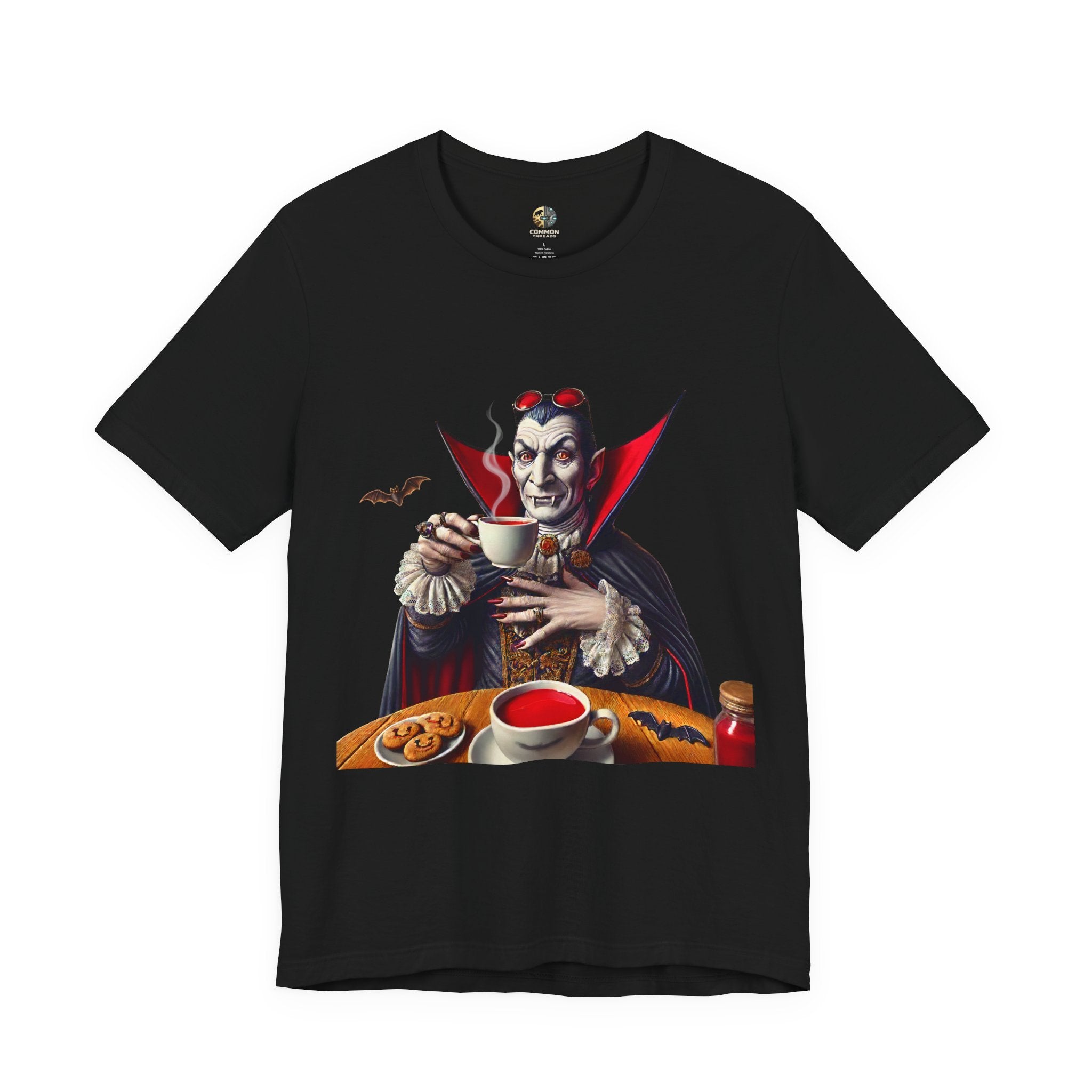 Black T-shirt featuring a classic vampire dressed like Count Dracula sitting at a table, wearing red sunglasses and drinking from a teacup filled with red liquid