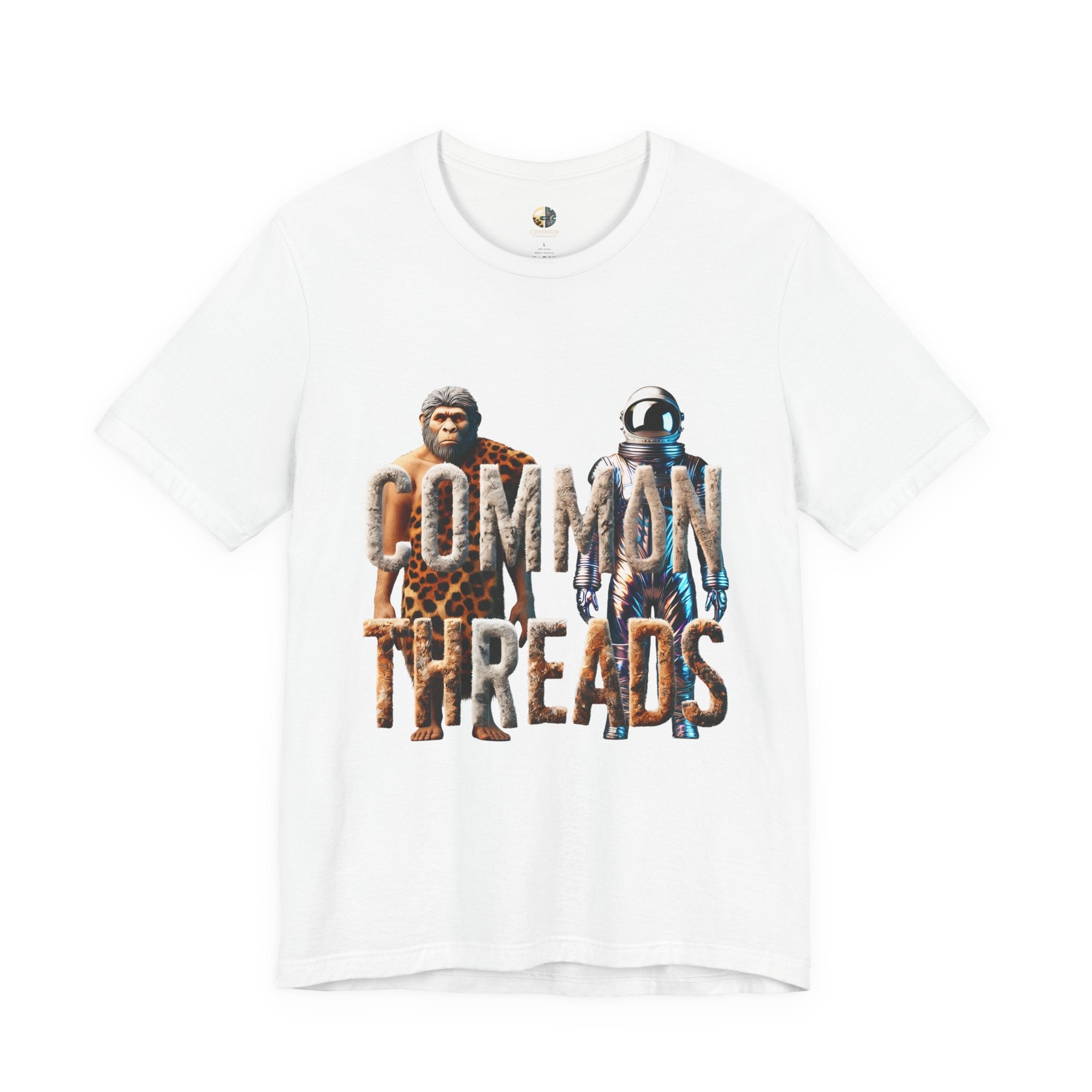 White T-shirt featuring a graphic of a caveman in animal pelts standing beside a chrome-plated astronaut, with the text ‘Common Threads‘