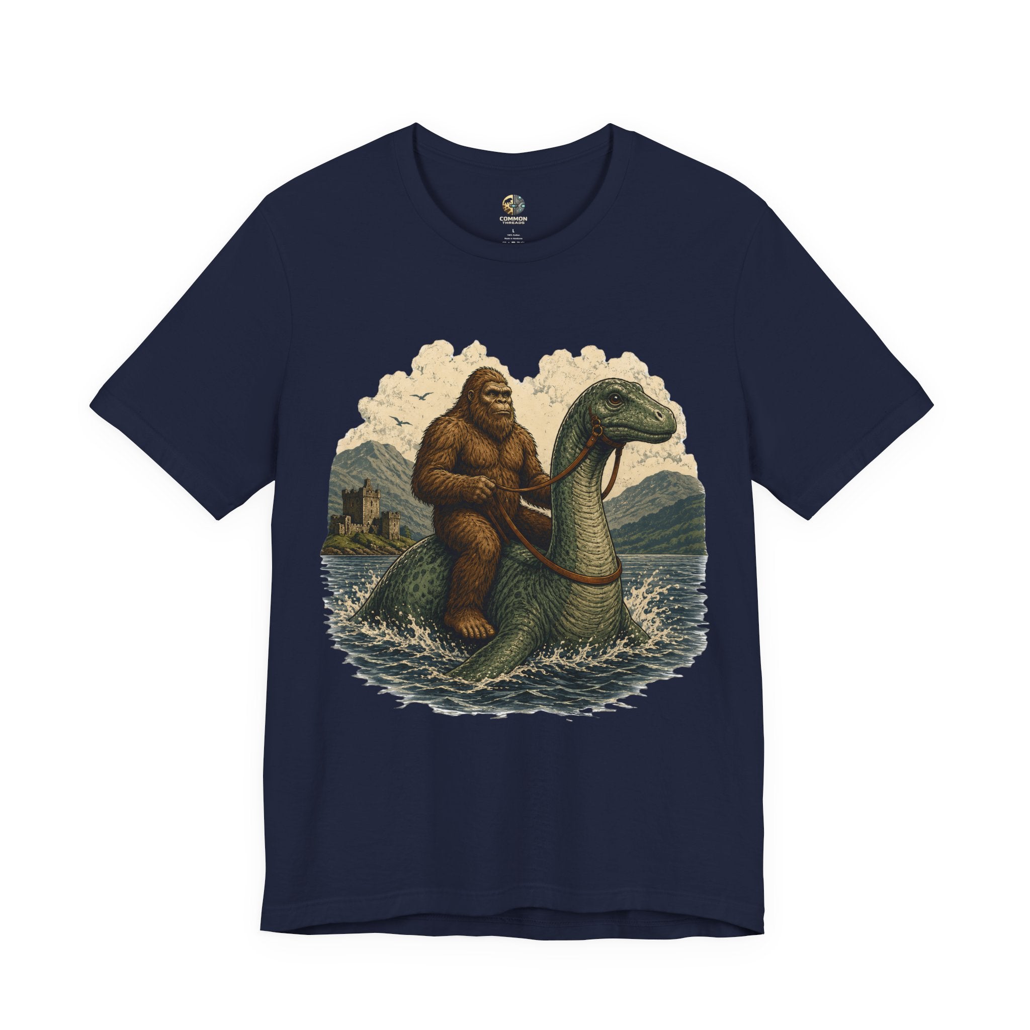 Navy blue t-shirt featuring bigfoot riding on the Loch Ness monster