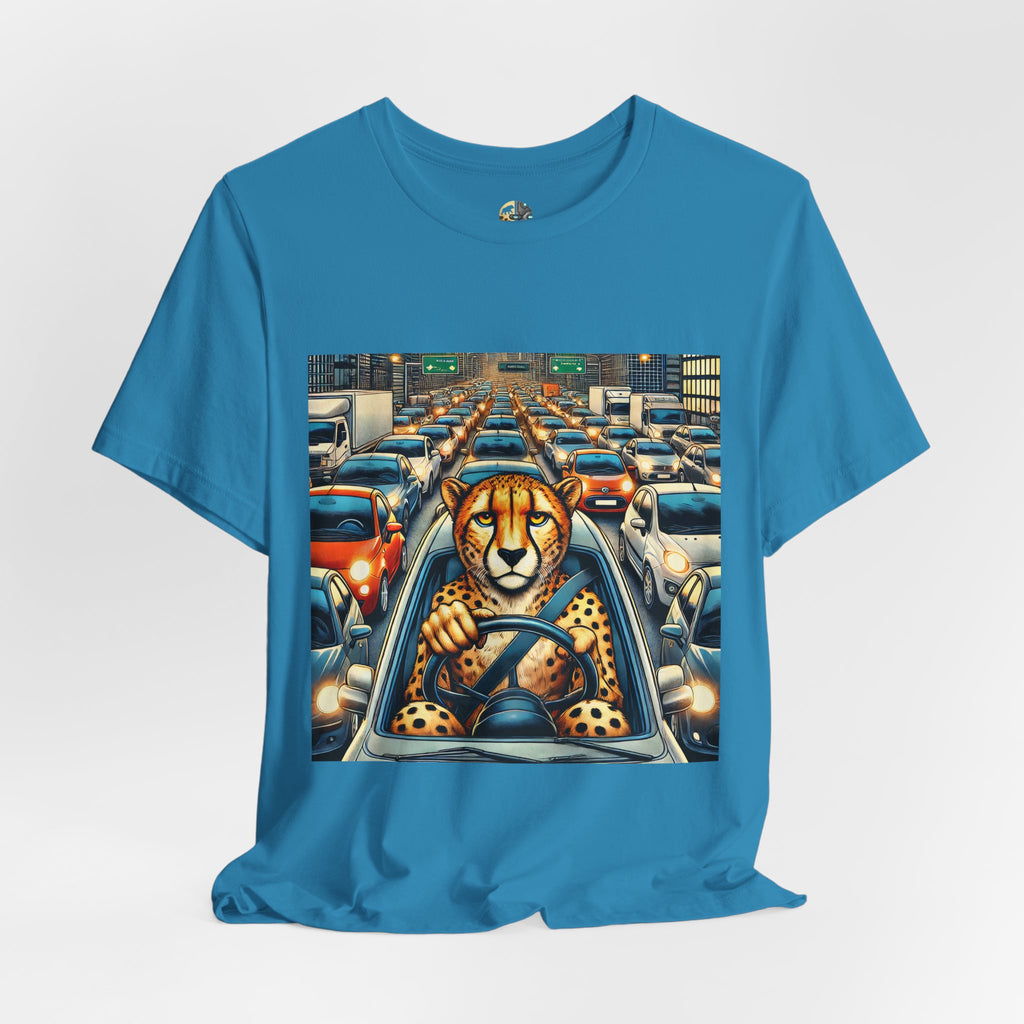 Aqua blue T-shirt featuring a graphic of a cheetah sitting in the driver’s seat of a car stuck in heavy city traffic