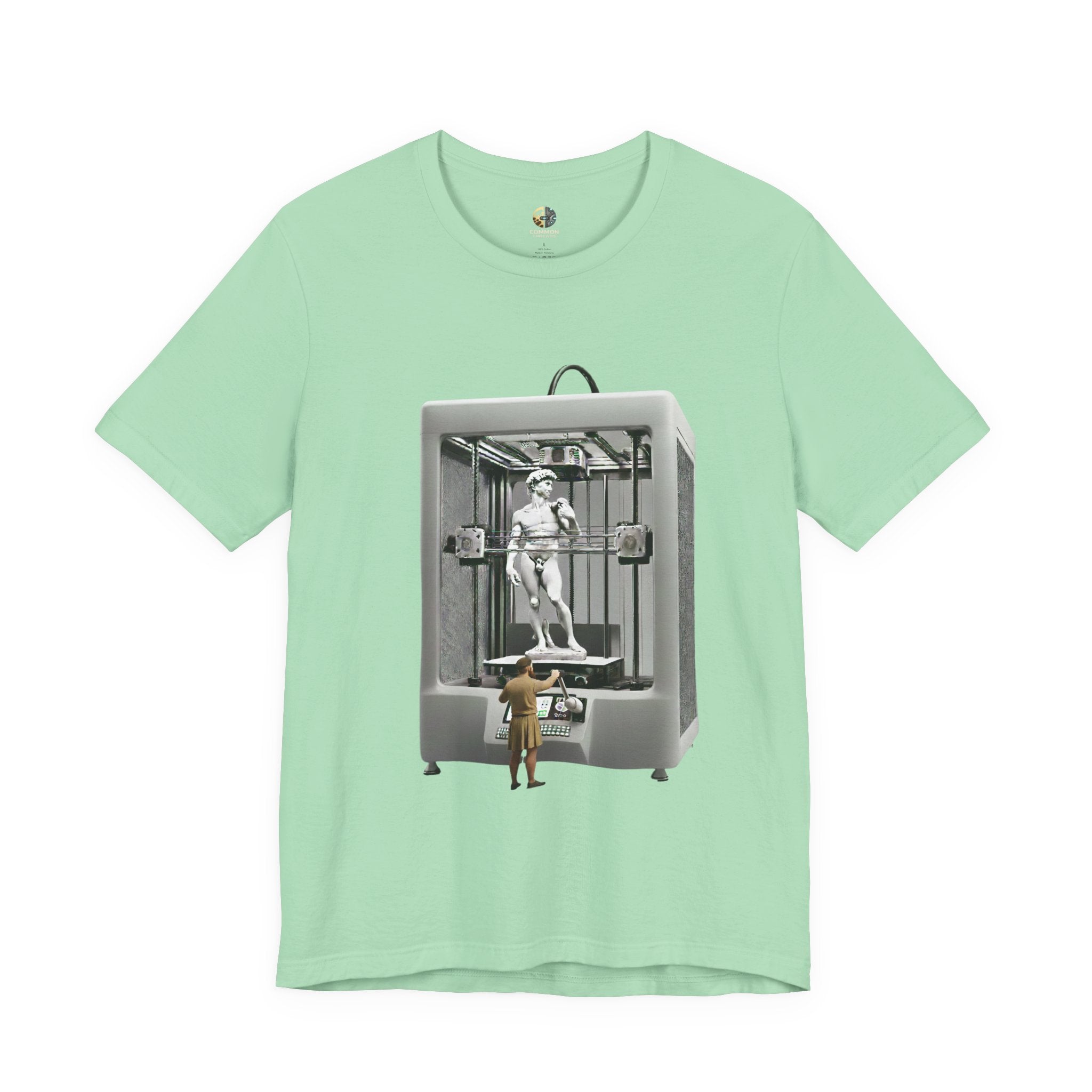 Mint green T-shirt featuring a graphic of Michelangelo’s David statue being created inside a large 3D printer, with Michelangelo standing at the controls