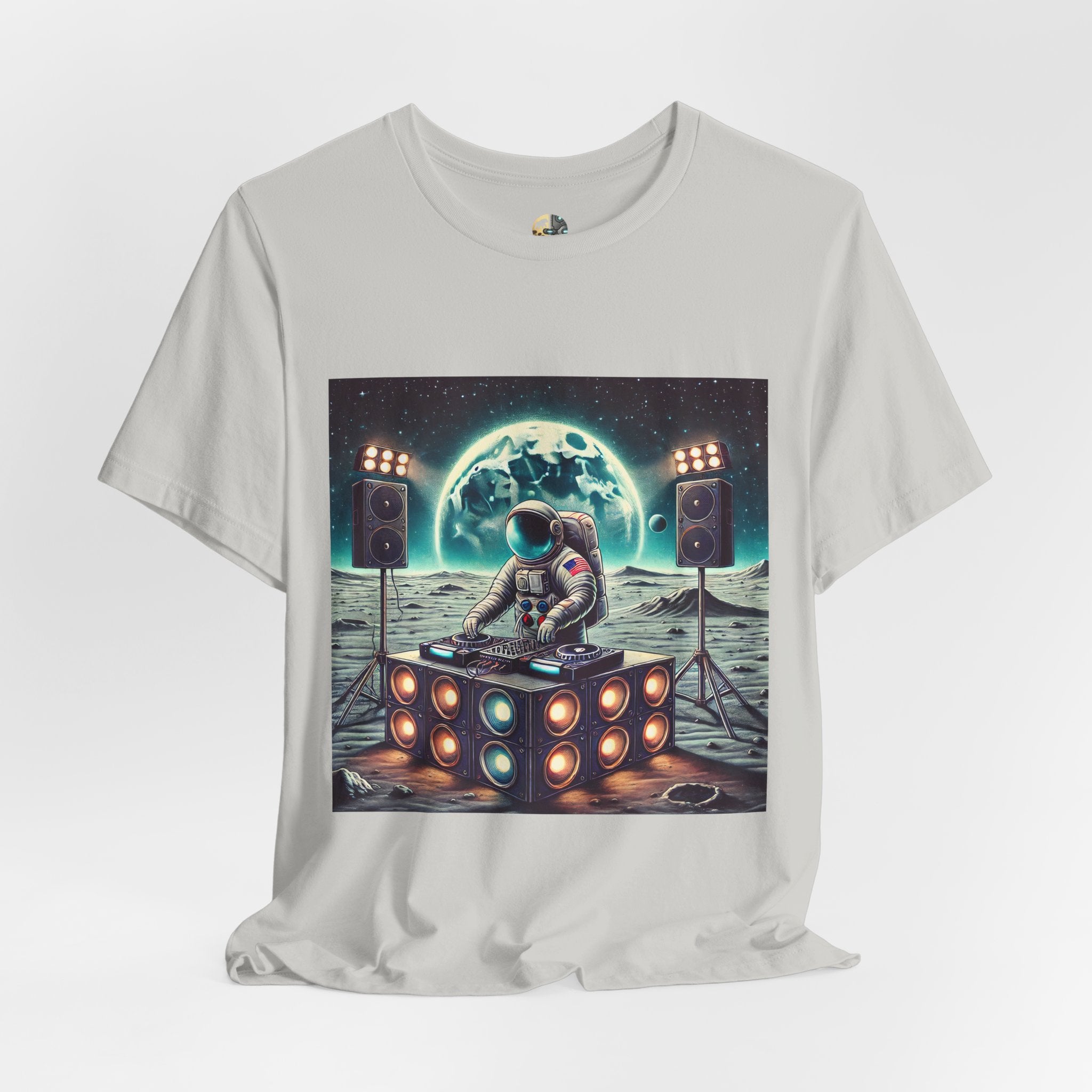 Silver T-shirt with graphic of an astronaut on the moon DJing with large speakers, with Earth visible in the starry sky