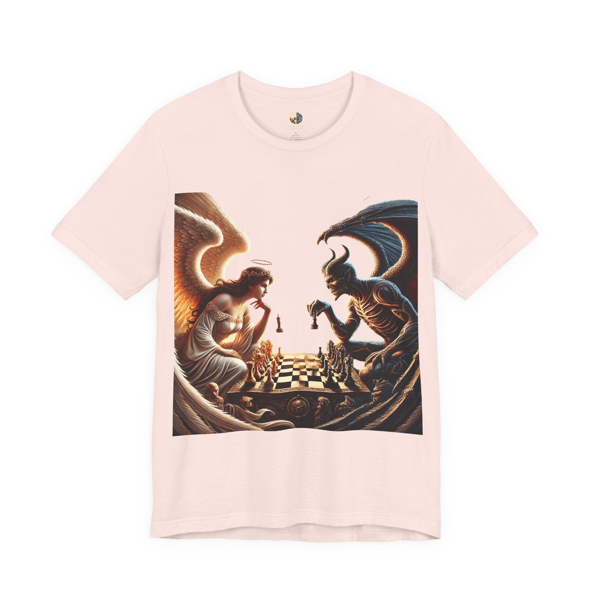 Soft pink T-shirt featuring a graphic of an angel and a demon playing chess, with a golden king piece levitating