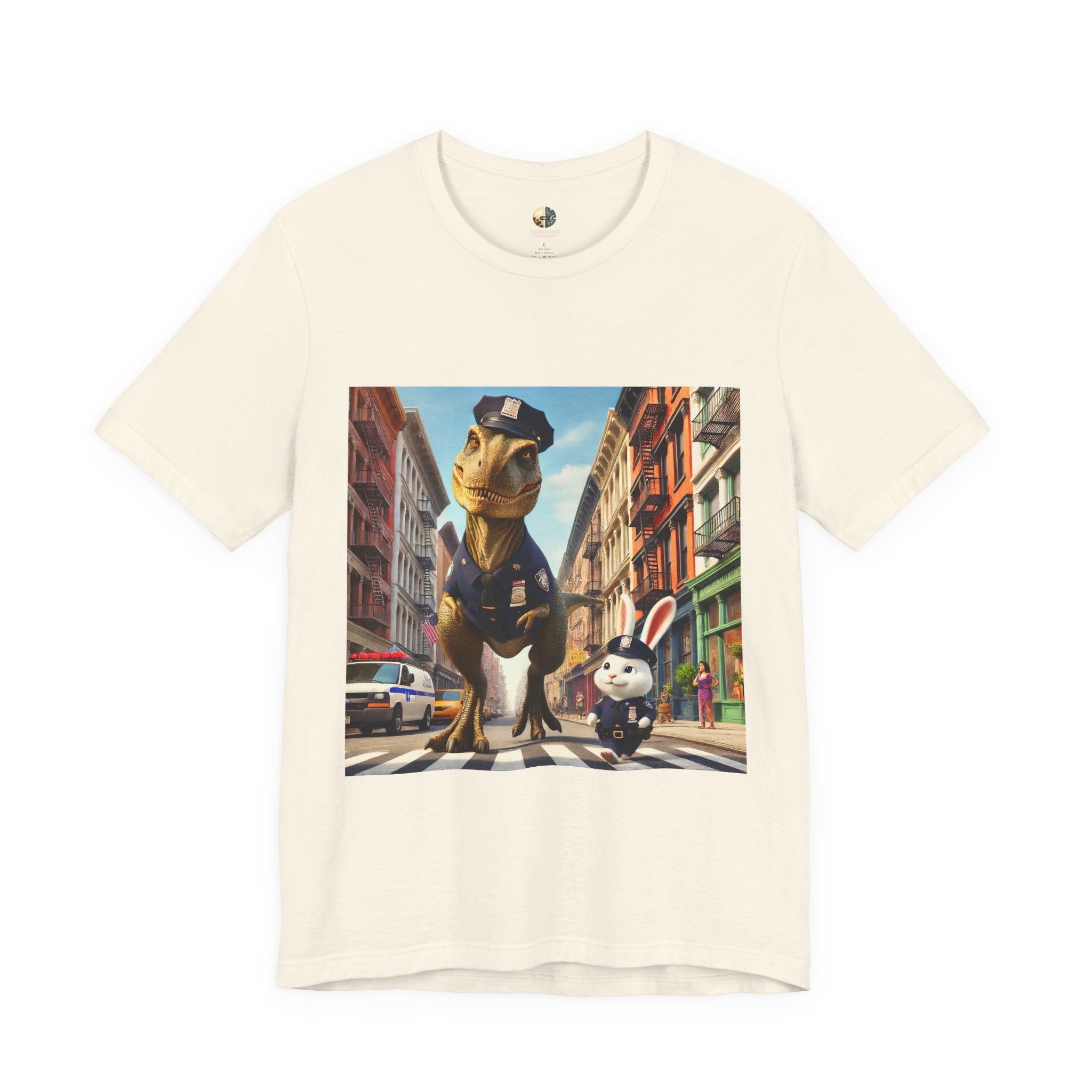 Natural color T-shirt showing a T-Rex and a bunny dressed as police officers standing together on a crosswalk in a New York–style urban setting
