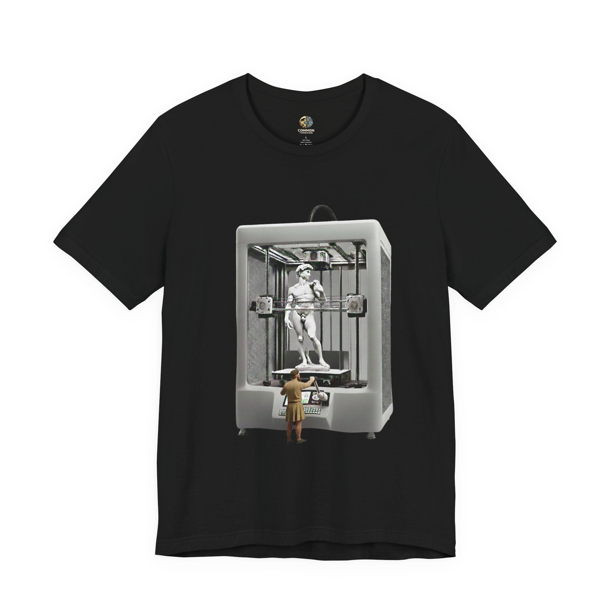 Black T-shirt featuring a graphic of Michelangelo’s David statue being created inside a large 3D printer, with Michelangelo standing at the controls