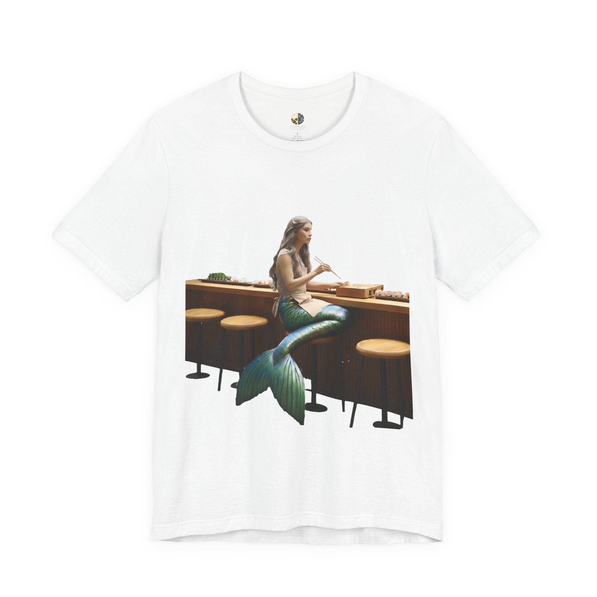 White T-shirt with graphic of a mermaid wearing a chef’s apron sitting at a sushi bar and eating sushi with chopsticks