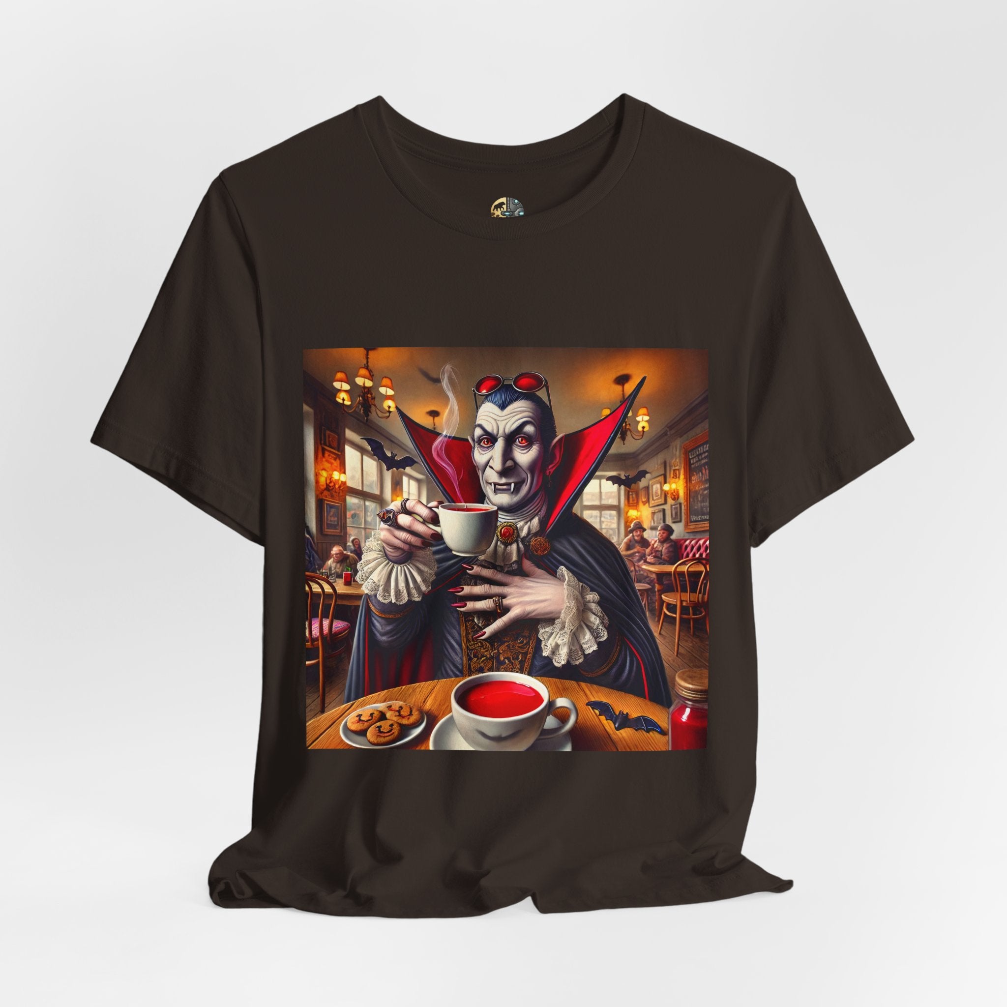 Brown T-shirt featuring a classic vampire dressed like Count Dracula sitting in a café, wearing red sunglasses and drinking from a teacup filled with red liquid