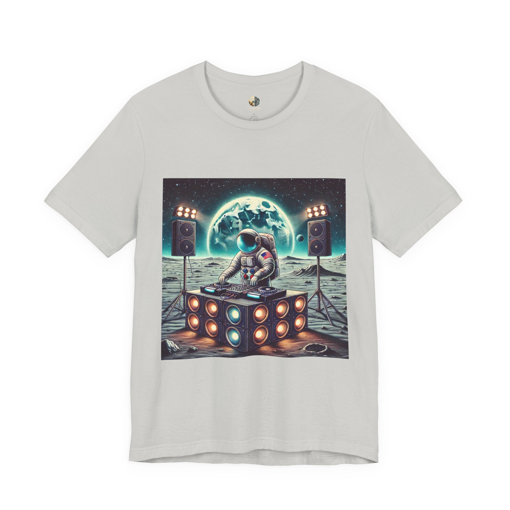 Silver T-shirt with graphic of an astronaut on the moon DJing with large speakers, with Earth visible in the starry sky