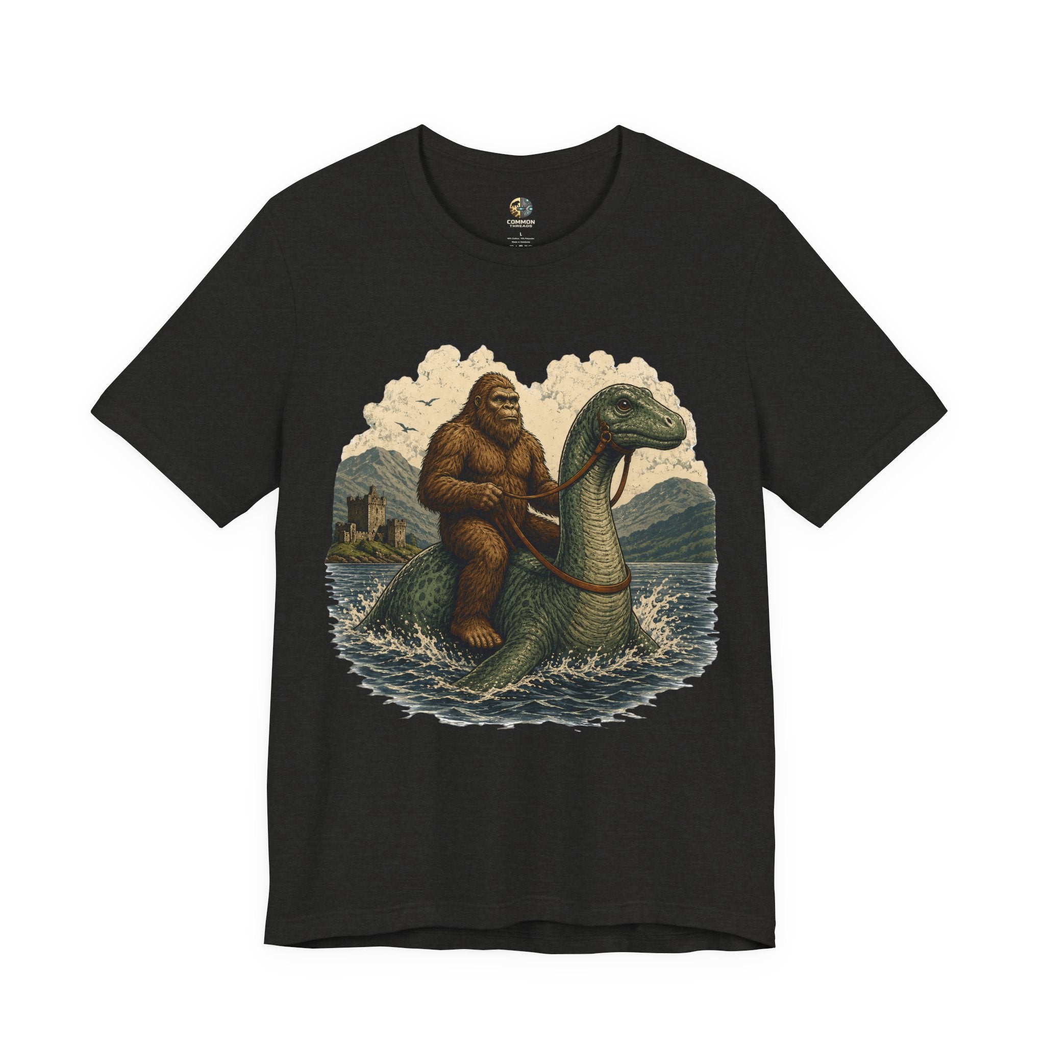 Black heather t-shirt featuring bigfoot riding on the Loch Ness monster