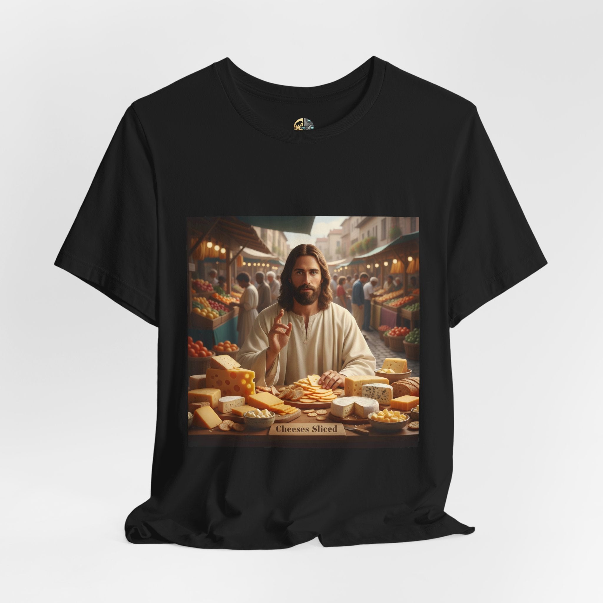 Black T-shirt featuring a graphic of Jesus in traditional robes at an ancient marketplace selling assorted cheeses, with a sign reading ‘Cheeses Sliced‘