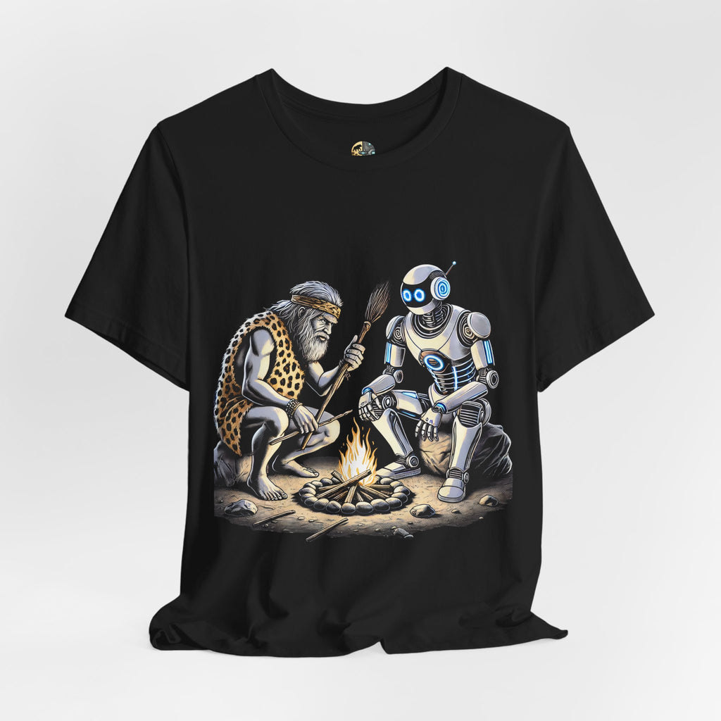 Black T-shirt featuring a graphic of a bearded caveman in a leopard-print pelt sitting by a campfire with a futuristic robot