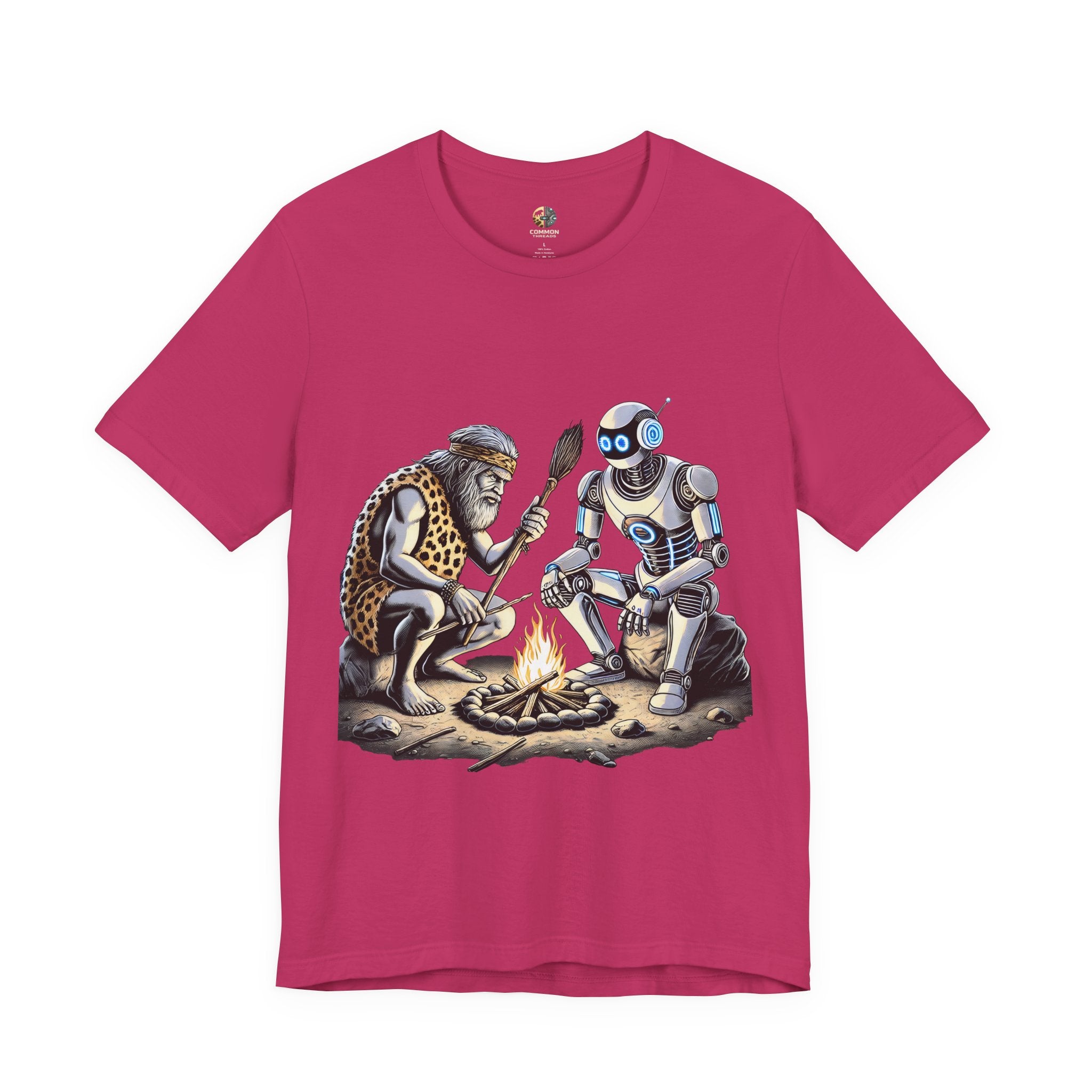 Berry color T-shirt featuring a graphic of a bearded caveman in a leopard-print pelt sitting by a campfire with a futuristic robot