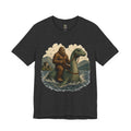 Dark grey heather t-shirt featuring bigfoot riding on the Loch Ness monster
