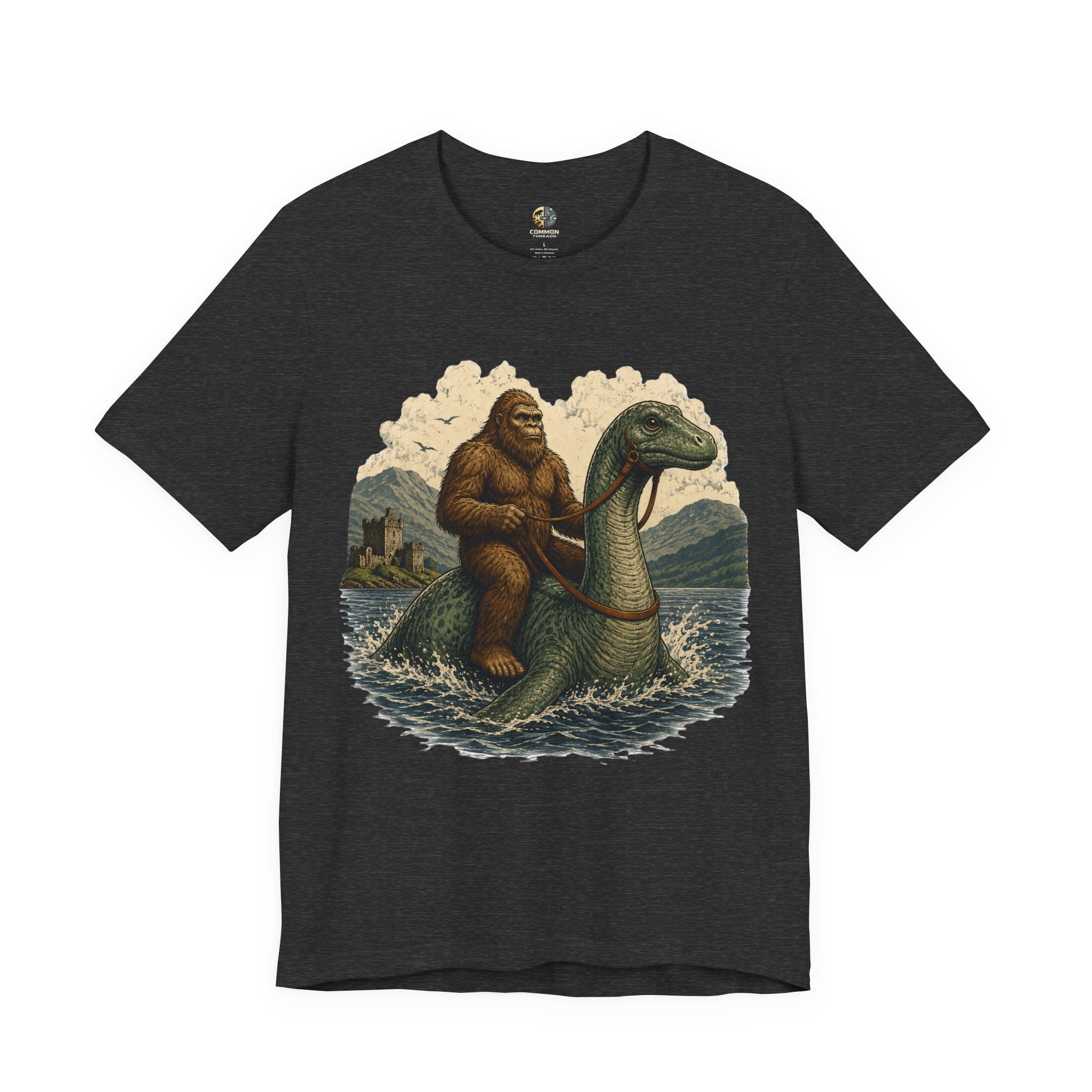 Dark grey heather t-shirt featuring bigfoot riding on the Loch Ness monster