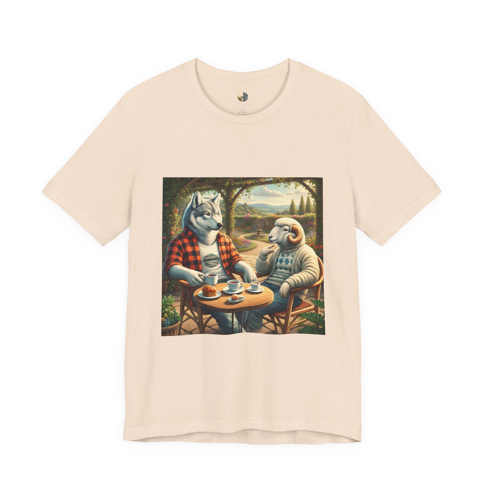 Soft creme color T-shirt featuring a graphic of a wolf in a flannel shirt and a ram in a patterned sweater sitting at a café table drinking coffee on a porch