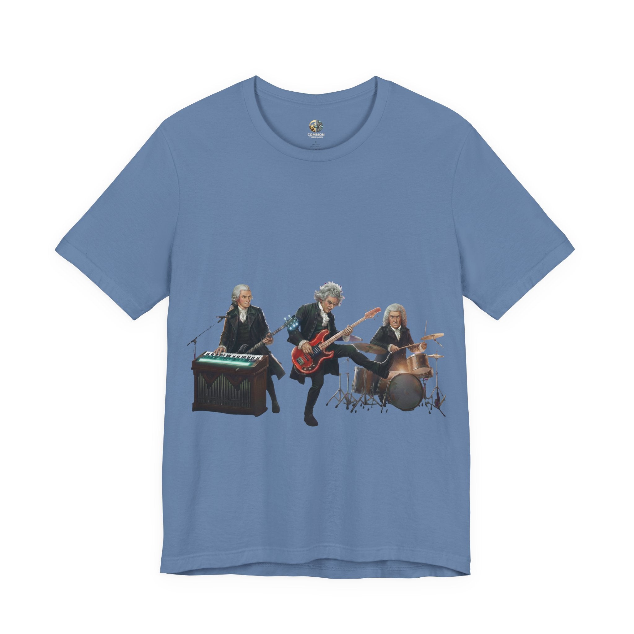 Lavender blue t-shirt featuring Mozart on bass and keyboard, Beethoven on electric guitar, and Bach on drums in a rock band scene
