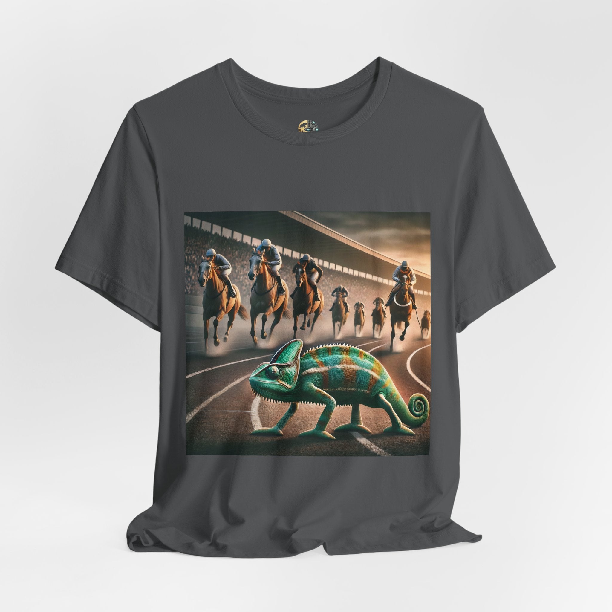 Asphalt grey T-shirt featuring a chameleon on a racetrack with a pack of racehorses approaching from behind