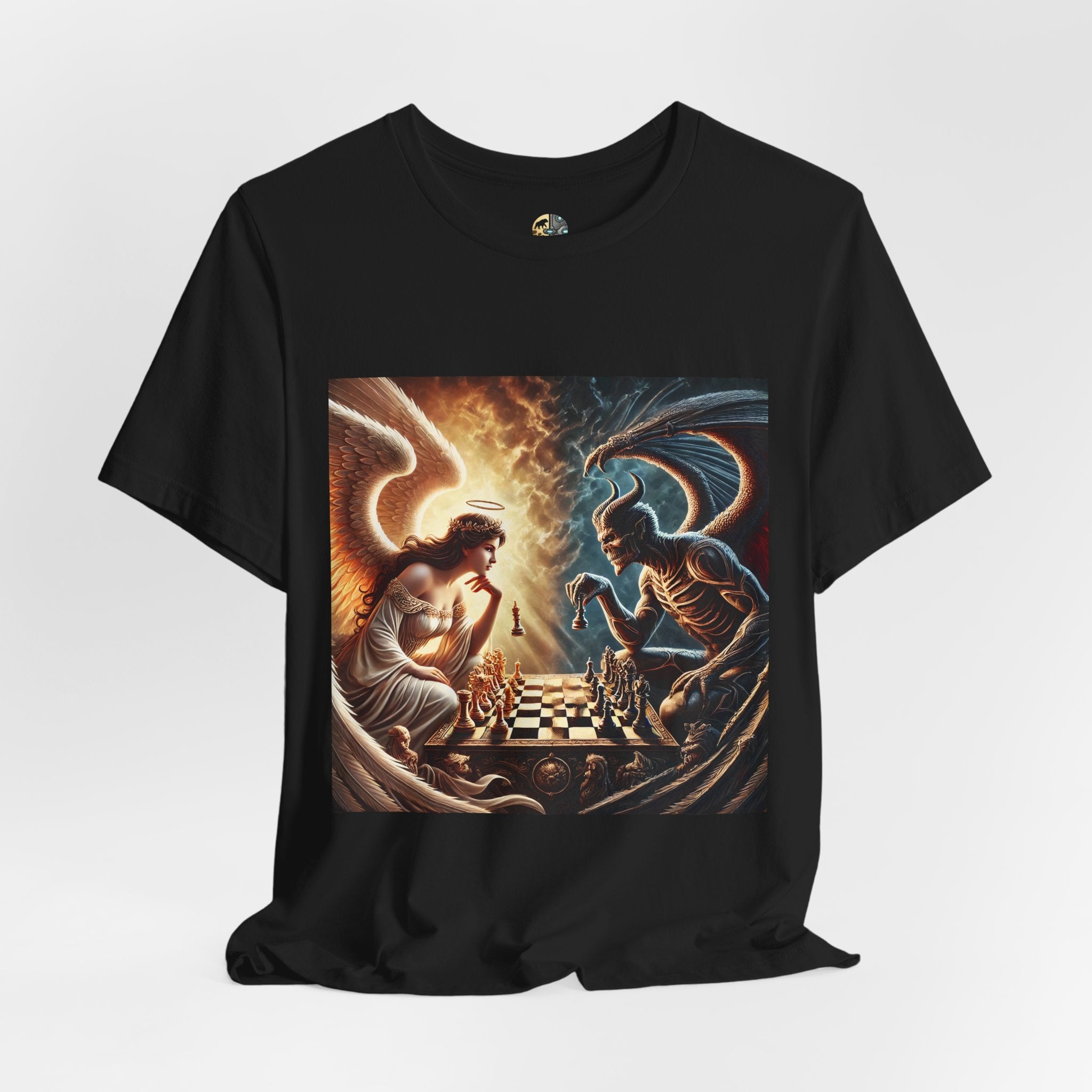 Black T-shirt featuring a graphic of an angel and a demon playing chess, with a golden king piece levitating, a dark background behind the demon and warm light tones behind the angel