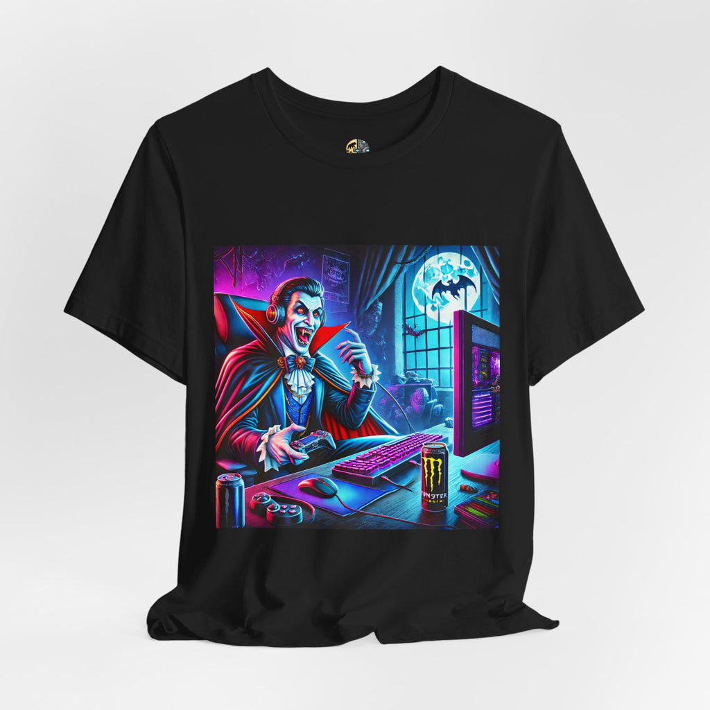 Black T-shirt graphic of a classic vampire wearing a gaming headset and holding a controller at a neon-lit gaming setup under a full moon