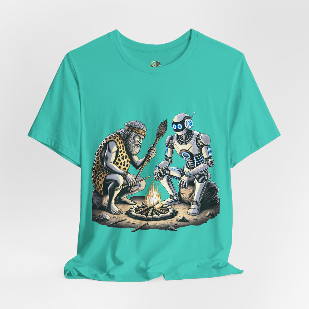 Teal T-shirt featuring a graphic of a bearded caveman in a leopard-print pelt sitting by a campfire with a futuristic robot