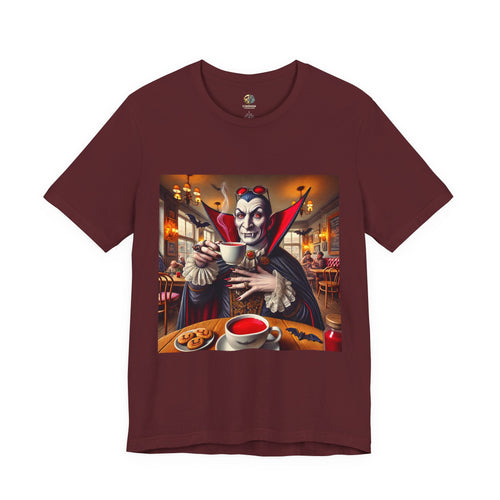 Maroon color T-shirt featuring a classic vampire dressed like Count Dracula sitting in a café, wearing red sunglasses and drinking from a teacup filled with red liquid