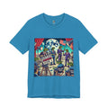 Aqua blue T-shirt featuring a graphic of lizard people in suits on a movie set staging a moon landing scene, with studio lights and a clapperboard