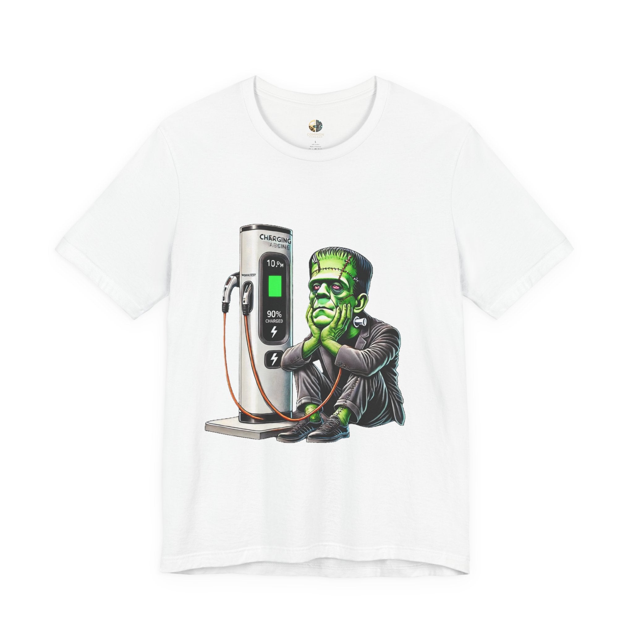 White T-shirt featuring a graphic of Frankenstein’s monster sitting at an electric charging station, plugged in and waiting for the charge to complete