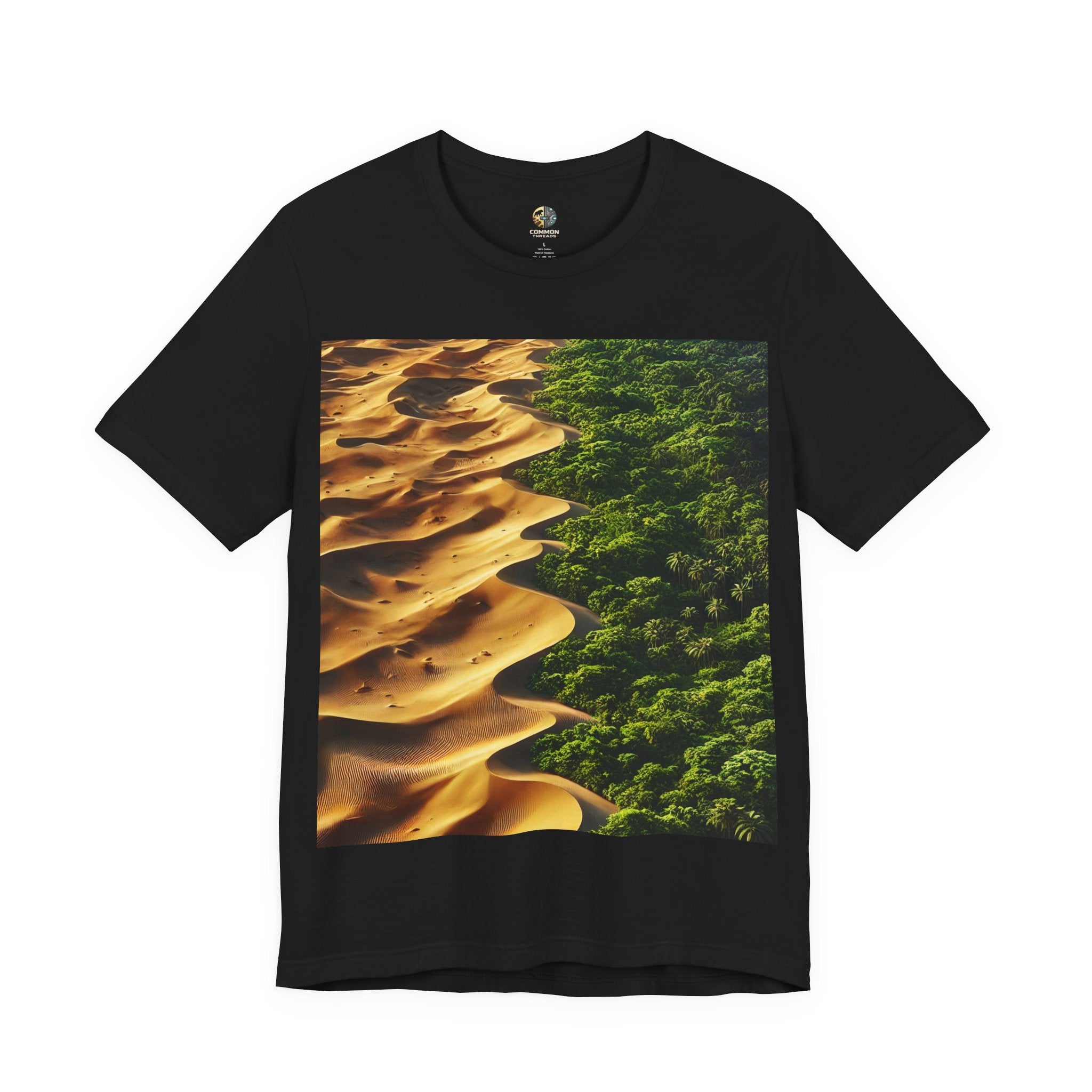 Black T-shirt featuring a split landscape with golden desert sand dunes on one side and a dense green rainforest on the other