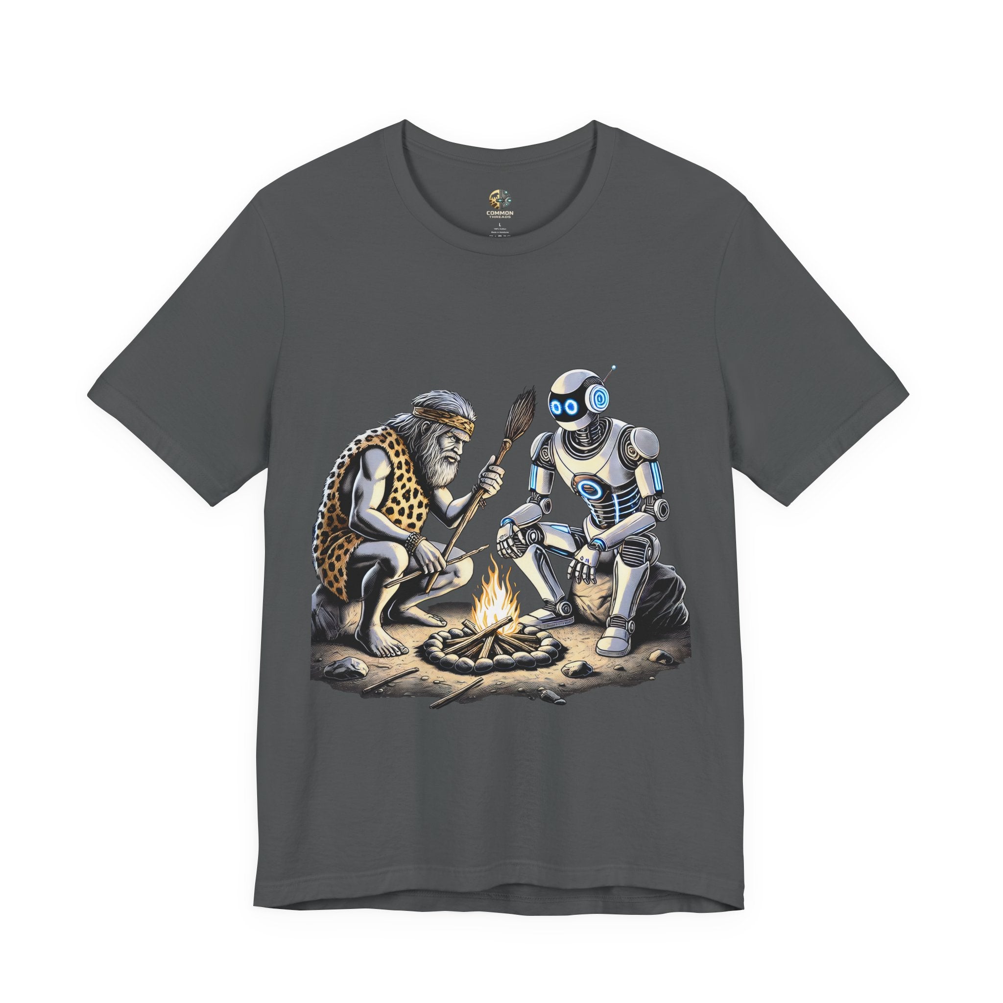 Asphalt grey T-shirt featuring a graphic of a bearded caveman in a leopard-print pelt sitting by a campfire with a futuristic robot