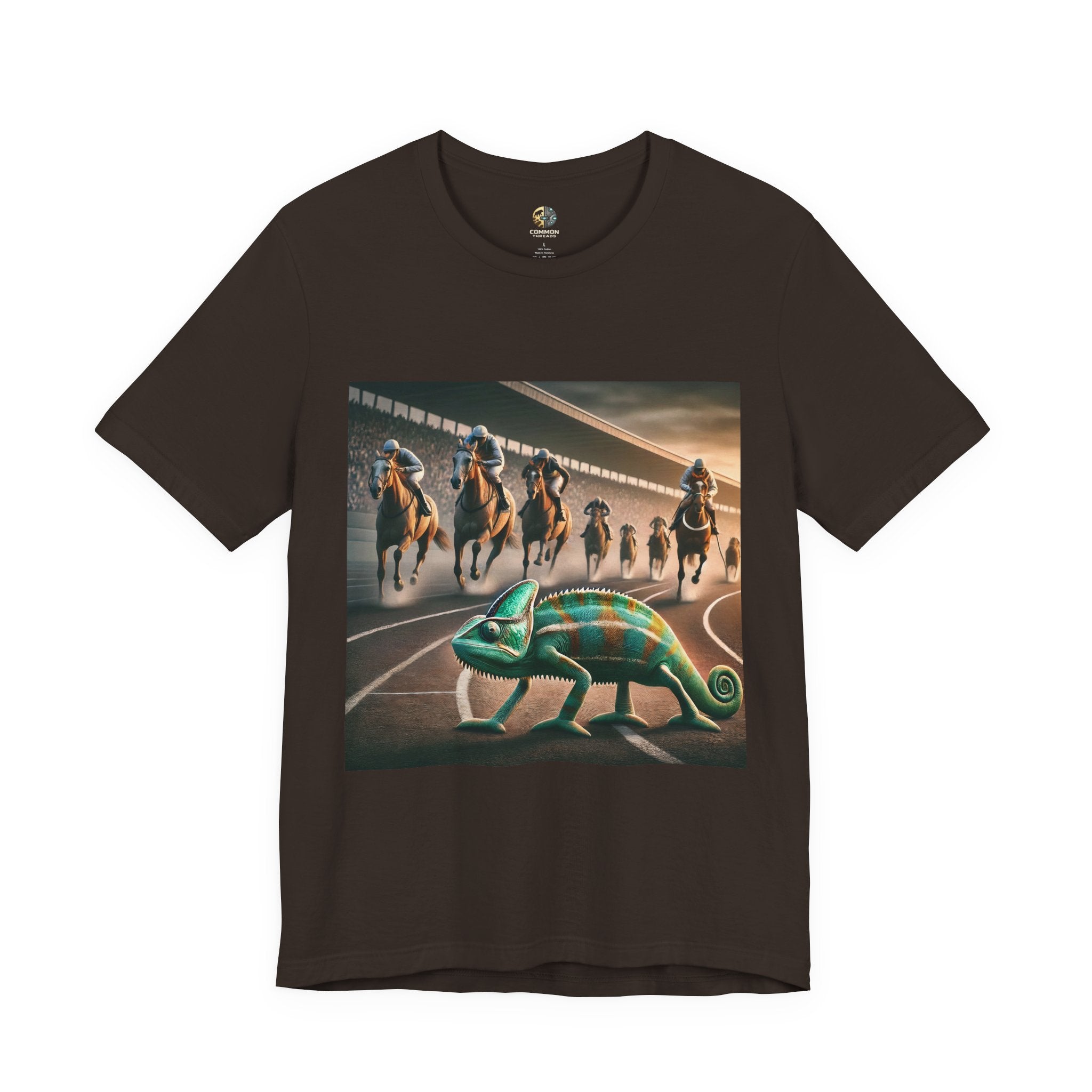 Brown T-shirt featuring a chameleon on a racetrack with a pack of racehorses approaching from behind