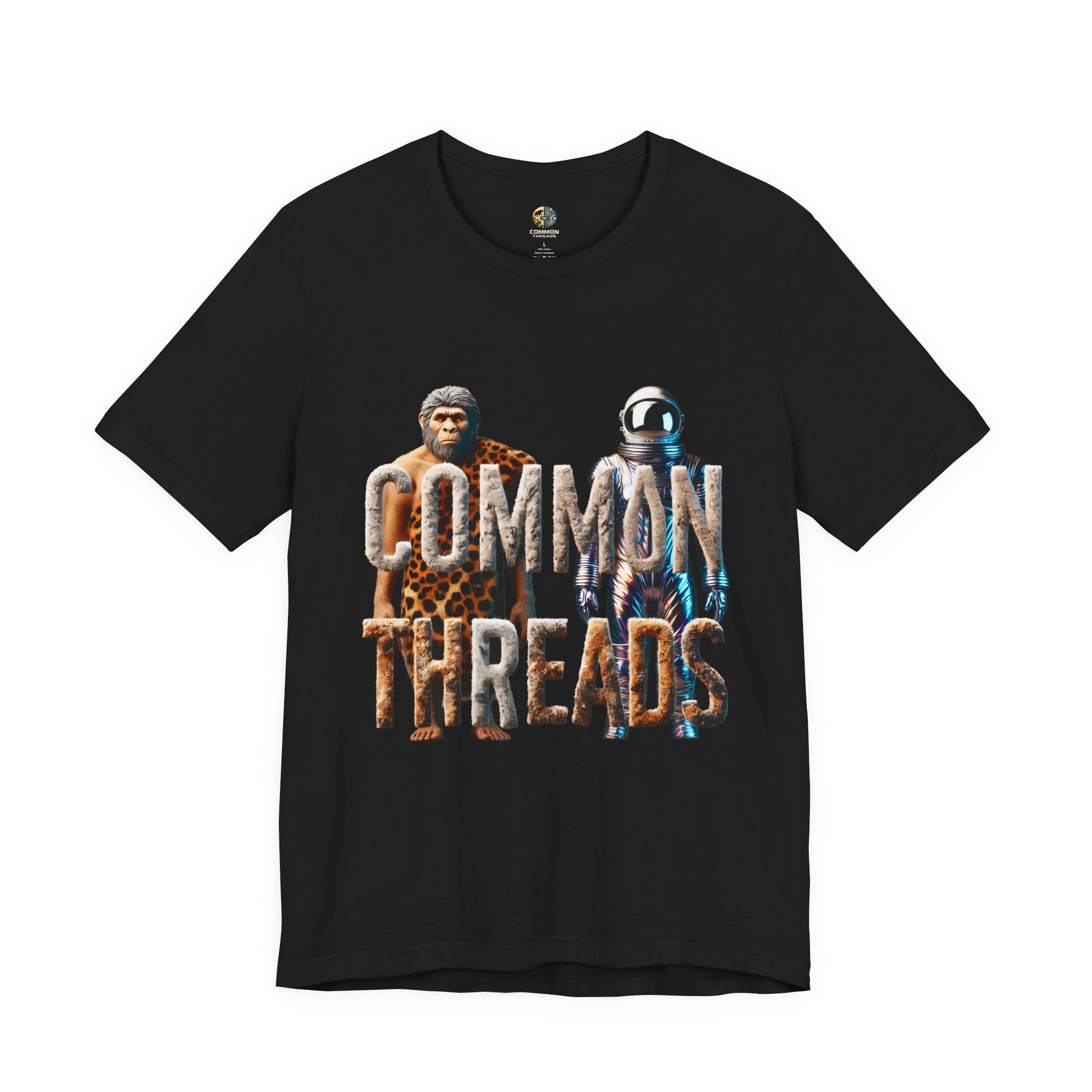 Black T-shirt featuring a graphic of a caveman in animal pelts standing beside a chrome-plated astronaut, with the text ‘Common Threads‘