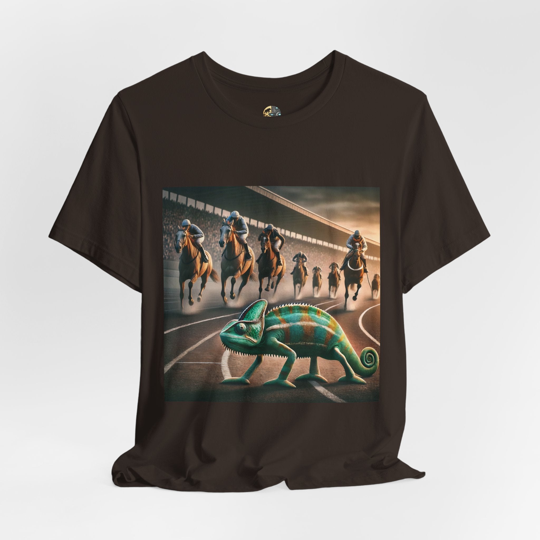 Brown T-shirt featuring a chameleon on a racetrack with a pack of racehorses approaching from behind