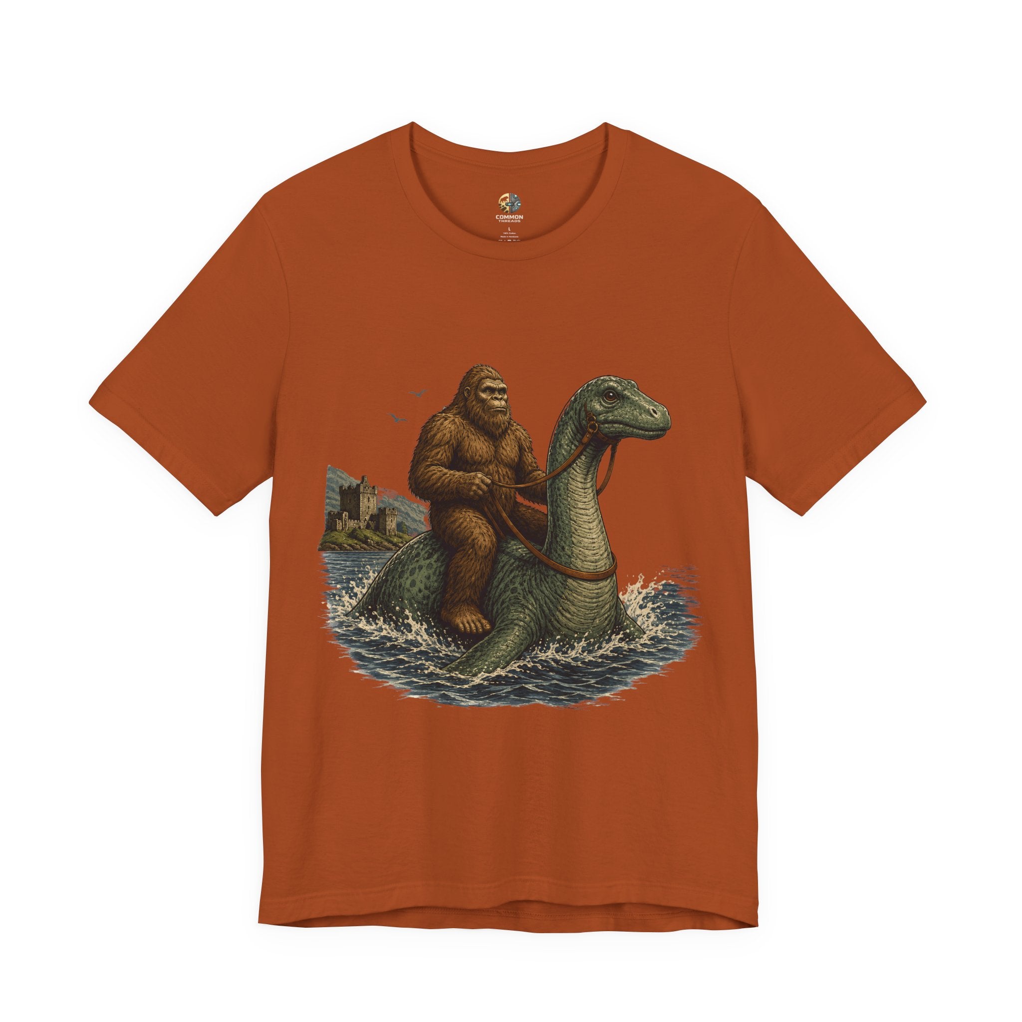 Autumn color t-shirt featuring bigfoot riding on the Loch Ness monster