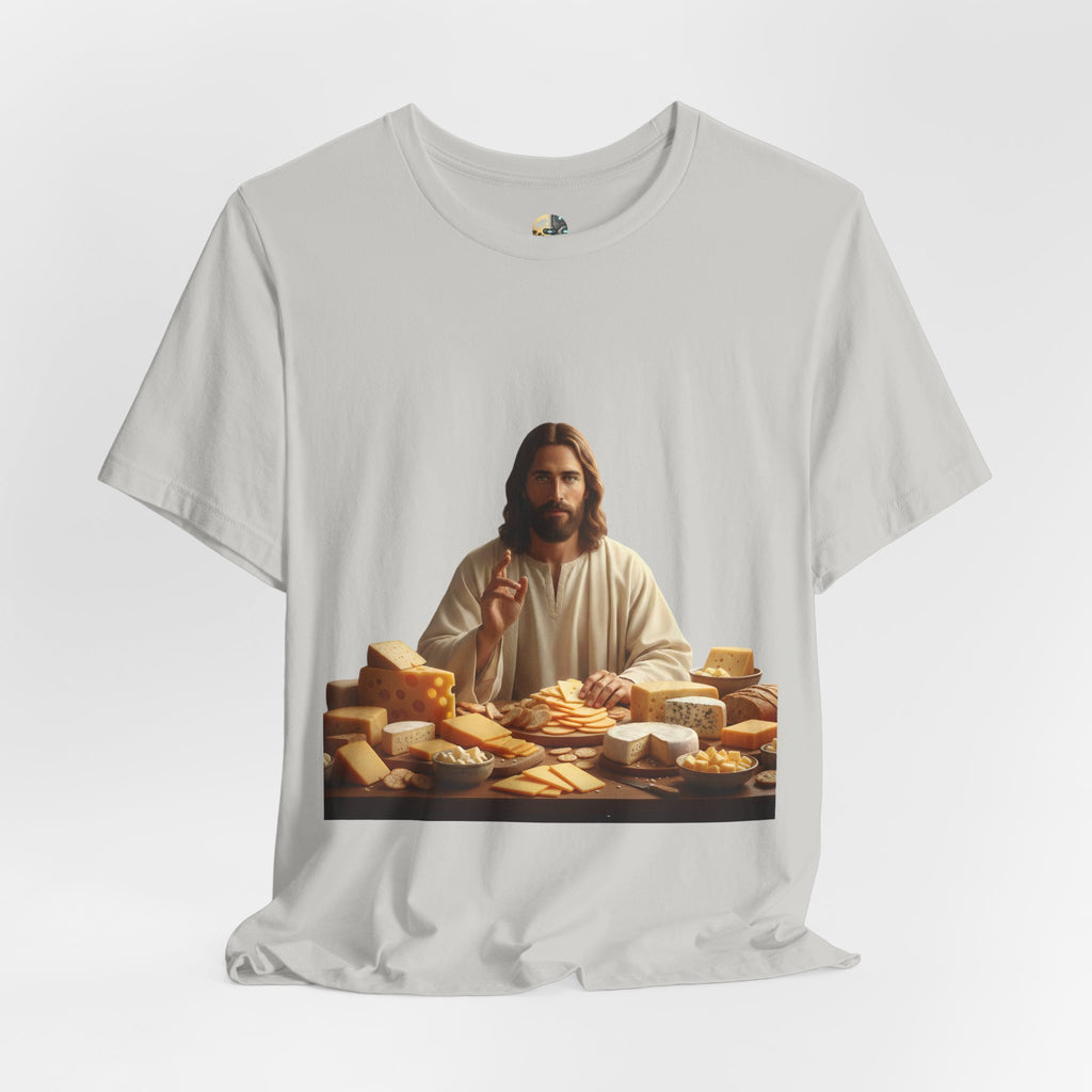 Silver T-shirt featuring a graphic of Jesus in traditional robes seated before a table filled with various cheeses, referencing a ‘Cheeses Sliced’ wordplay