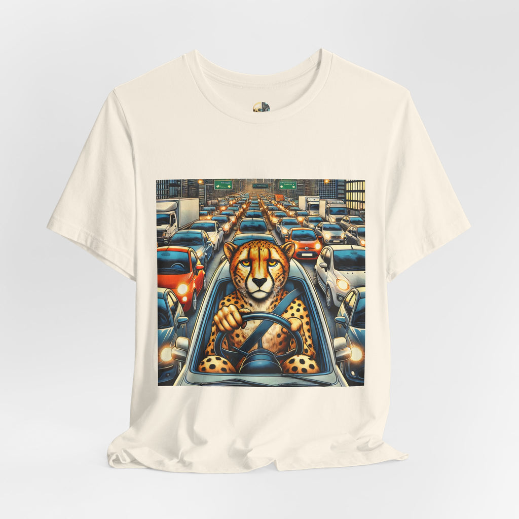 Natural color T-shirt featuring a graphic of a cheetah sitting in the driver’s seat of a car stuck in heavy city traffic