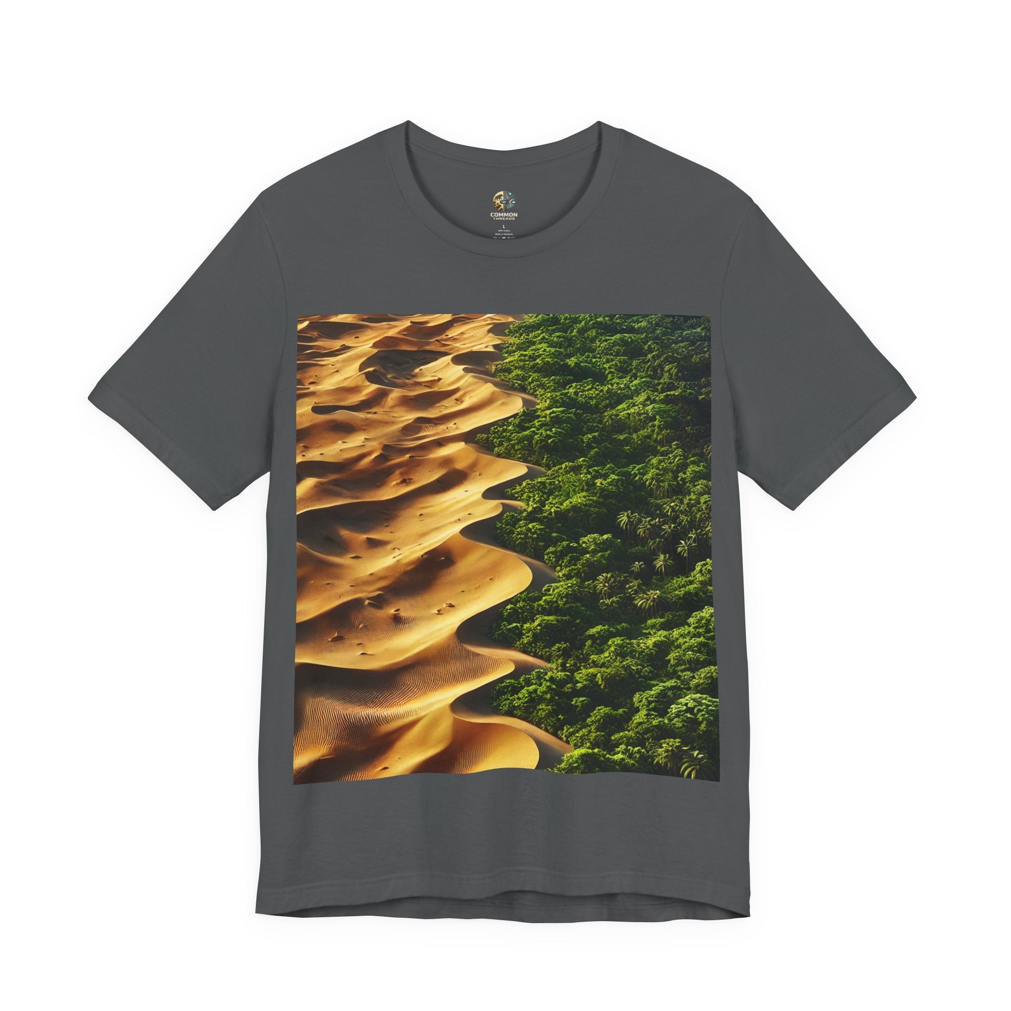 Asphalt grey T-shirt featuring a split landscape with golden desert sand dunes on one side and a dense green rainforest on the other
