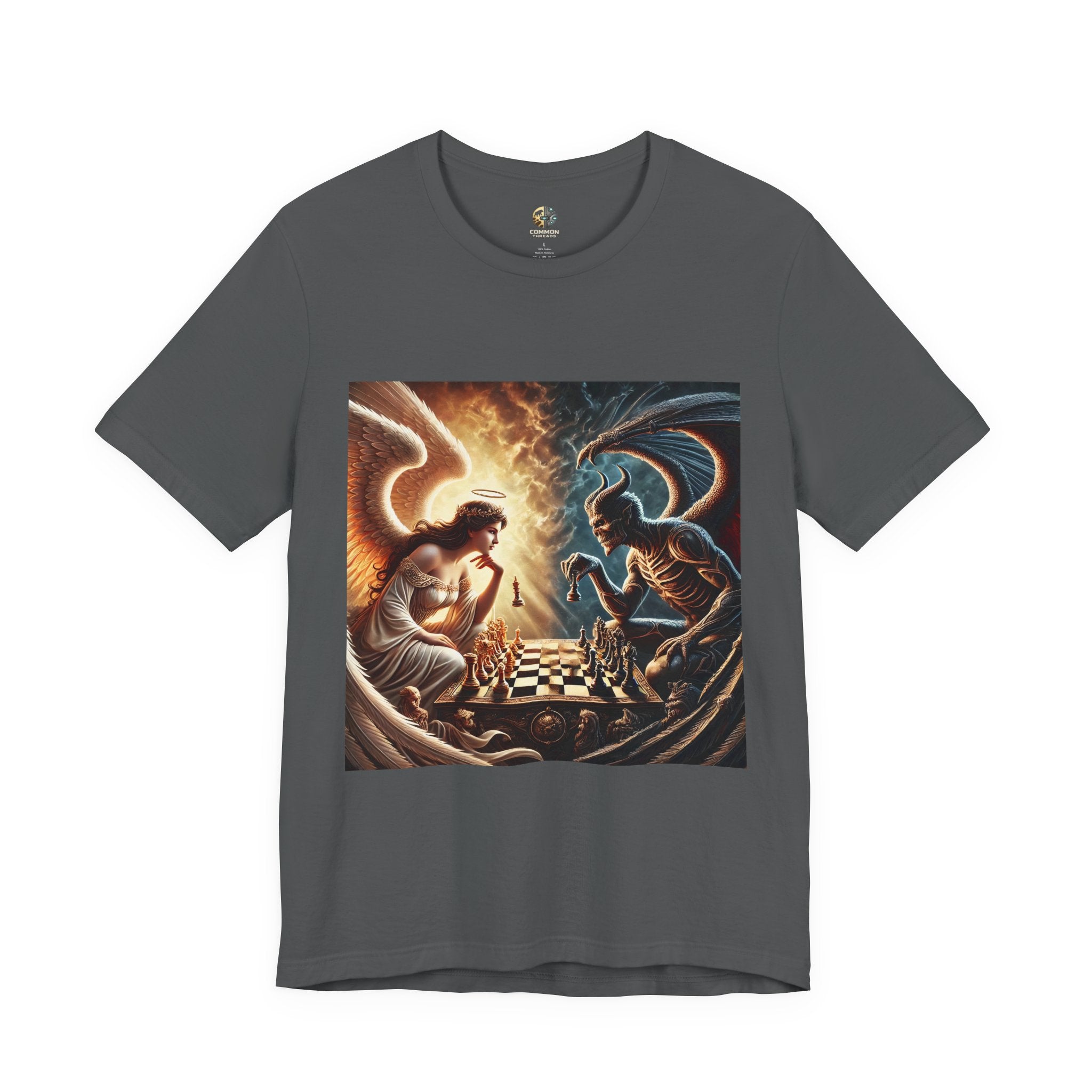 Asphalt grey T-shirt featuring a graphic of an angel and a demon playing chess, with a golden king piece levitating, a dark background behind the demon and warm light tones behind the angel