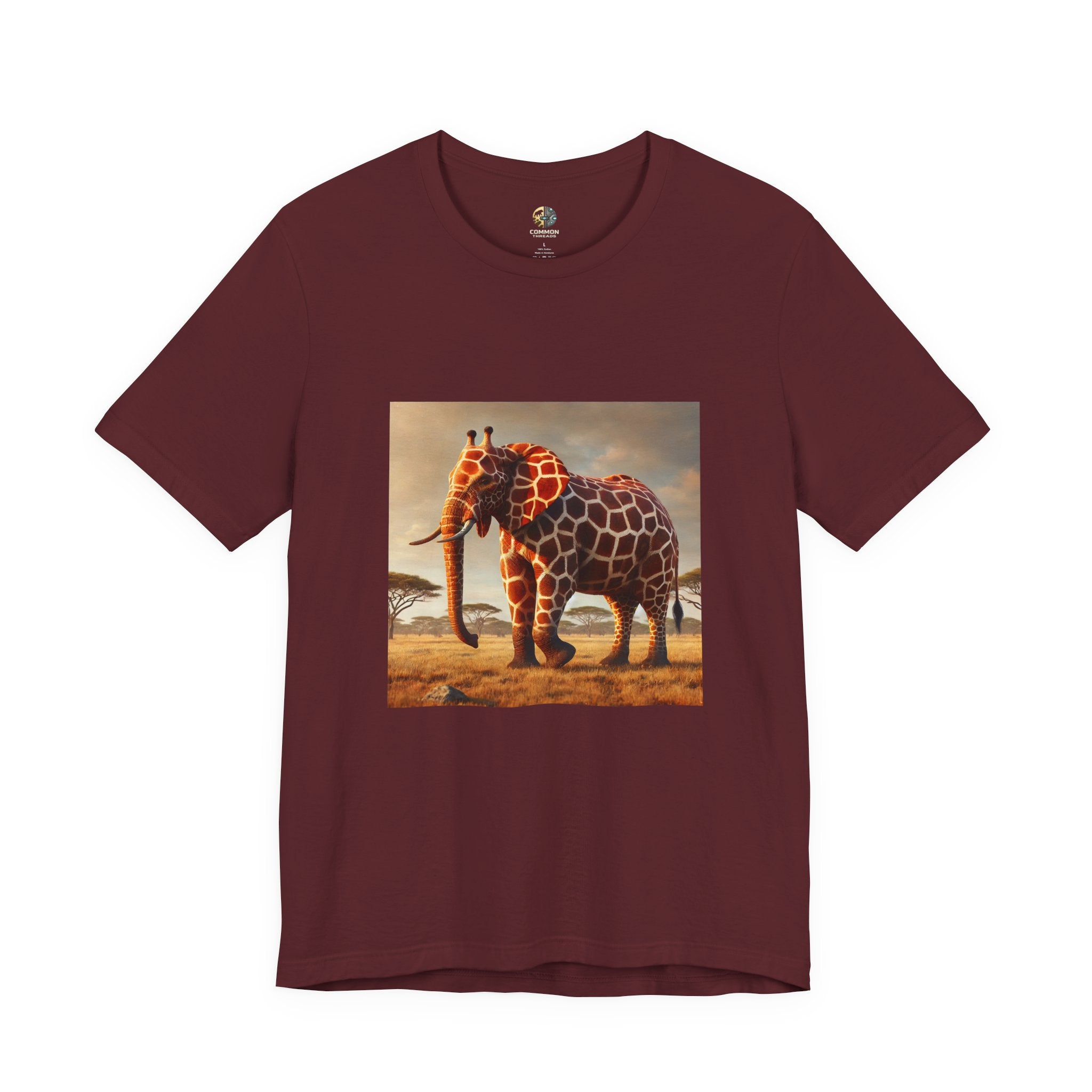 Maroon color T-shirt featuring a graphic of an elephant–giraffe hybrid with giraffe patterns and small ossicones, set against a savanna background