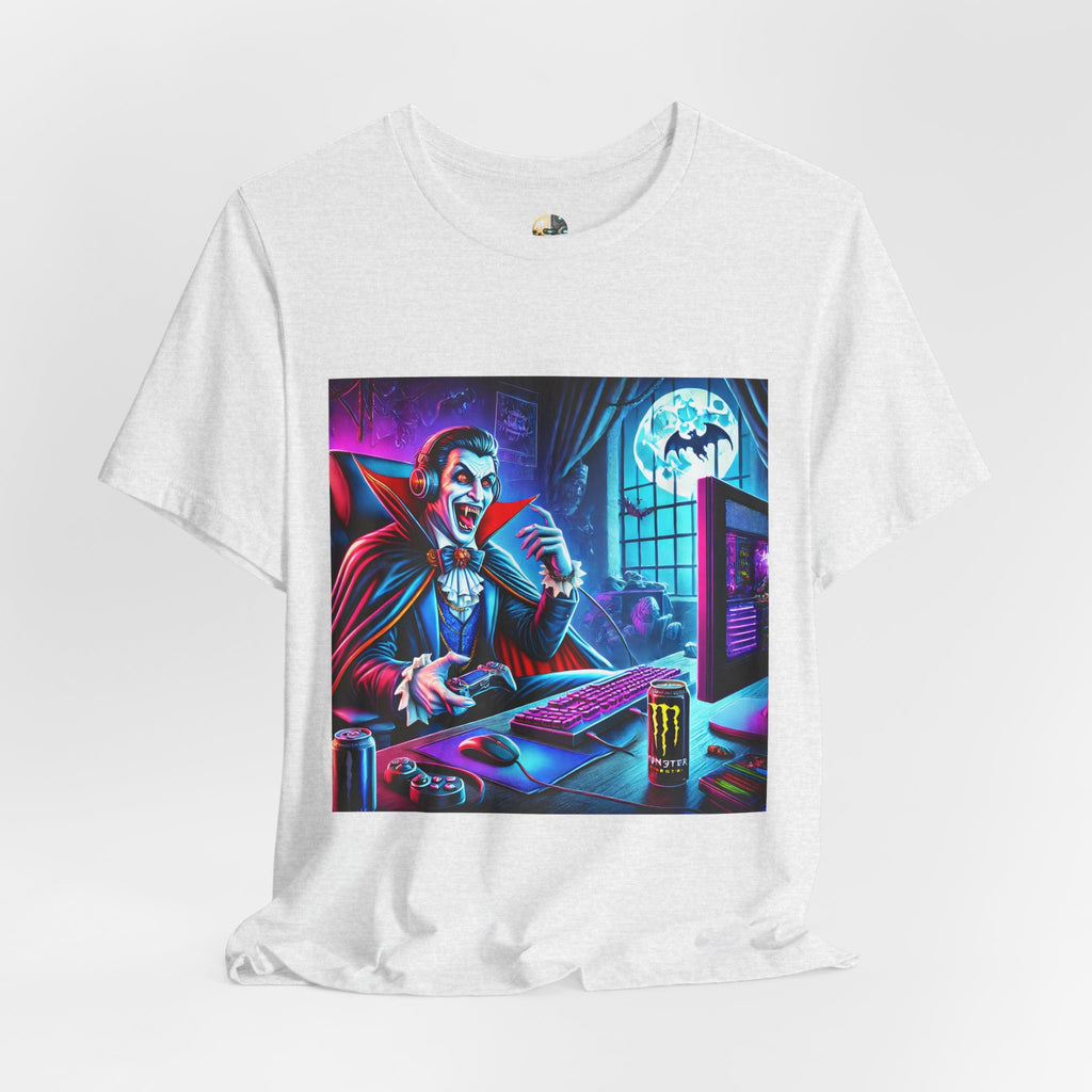 Ash color T-shirt graphic of a classic vampire wearing a gaming headset and holding a controller at a neon-lit gaming setup under a full moon