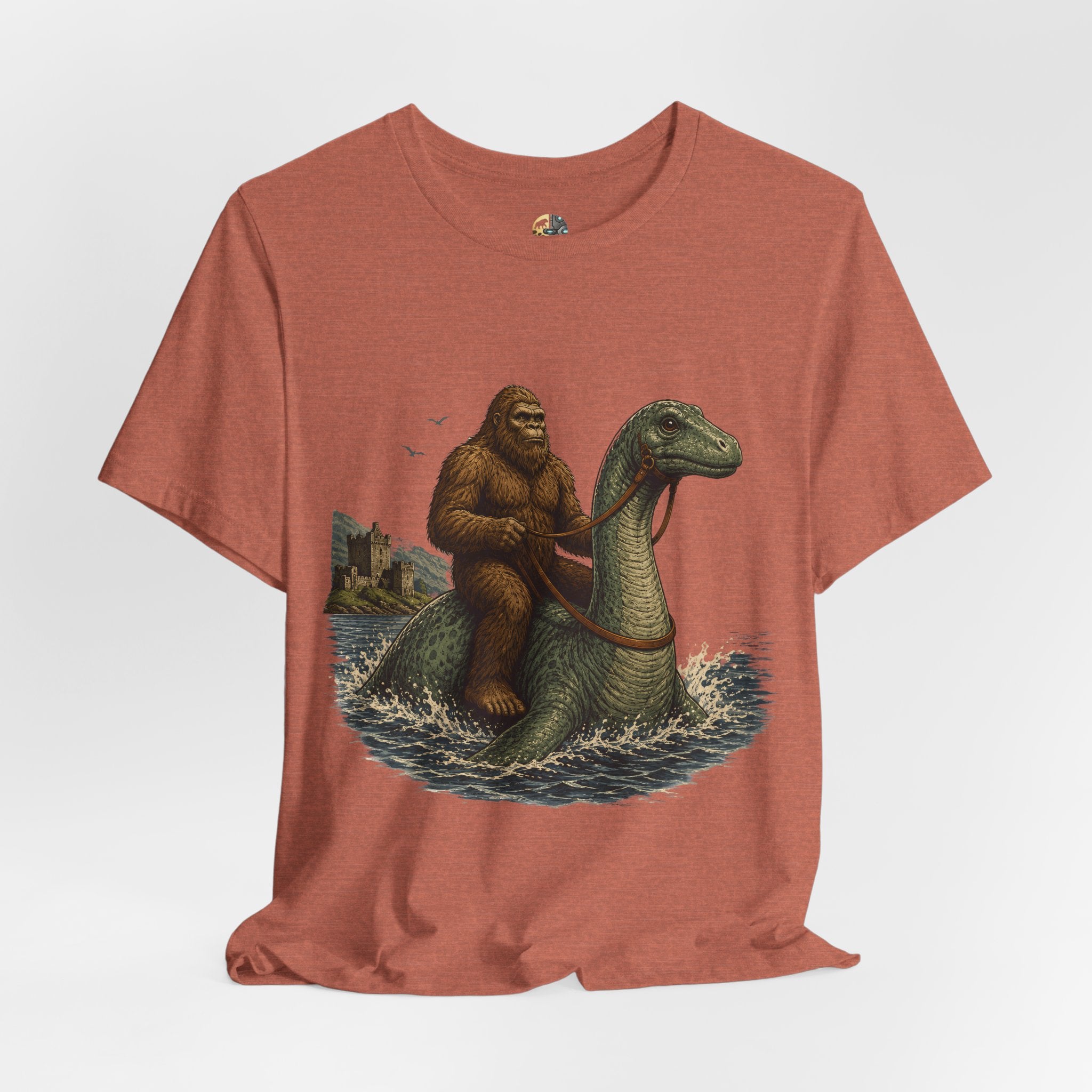 Heather clay  t-shirt featuring bigfoot riding on the Loch Ness monster