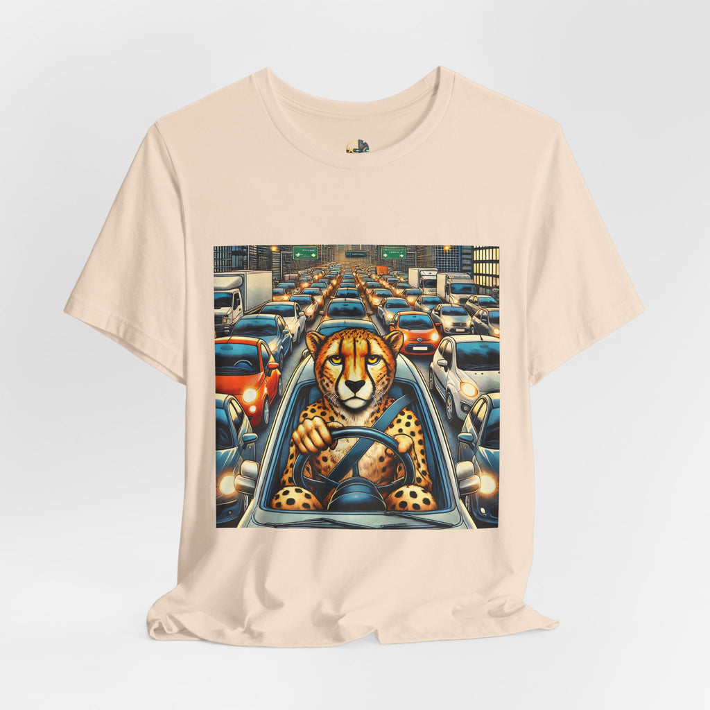 Soft creme T-shirt featuring a graphic of a cheetah sitting in the driver’s seat of a car stuck in heavy city traffic