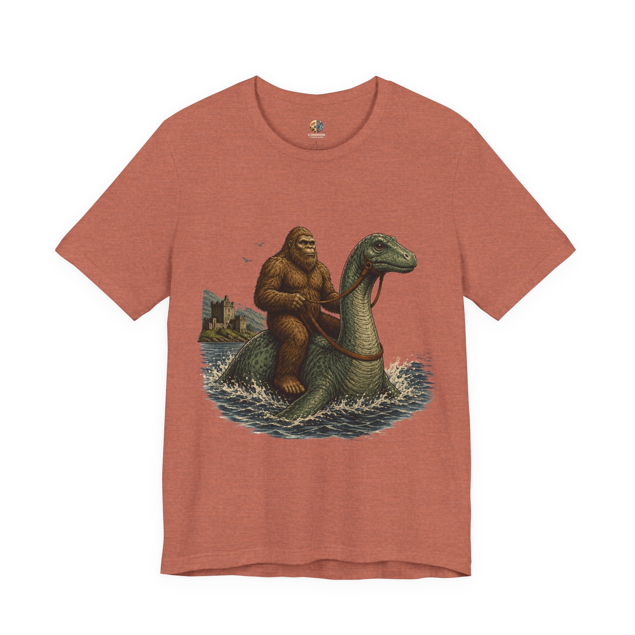 Heather clay  t-shirt featuring bigfoot riding on the Loch Ness monster