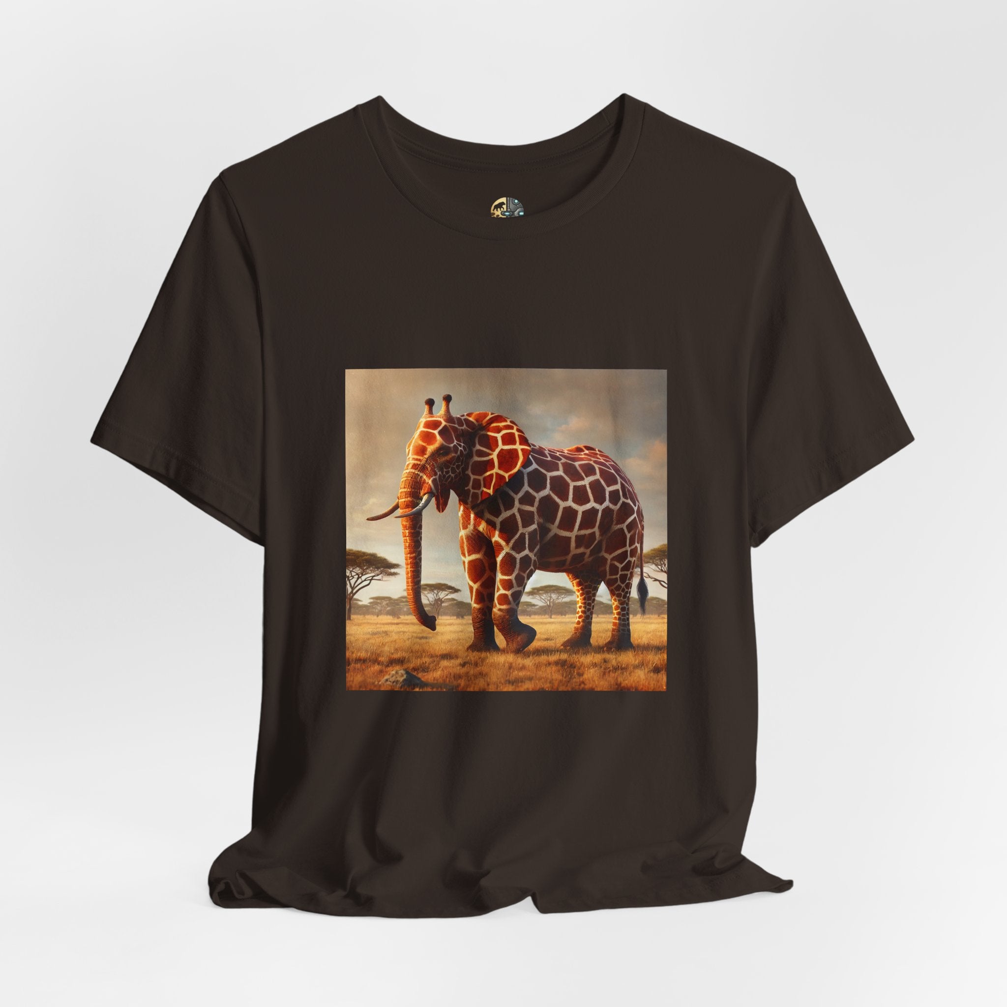 Brown T-shirt featuring a graphic of an elephant–giraffe hybrid with giraffe patterns and small ossicones, set against a savanna background