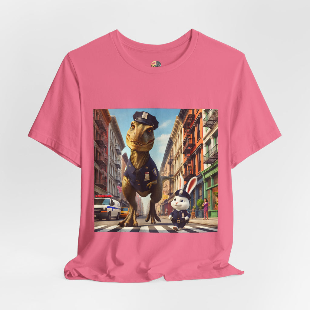 Charity pink T-shirt showing a T-Rex and a bunny dressed as police officers standing together on a crosswalk in a New York–style urban setting